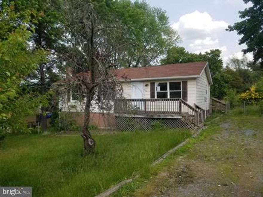 Rancher located on 0.51 acre near town, 3 bedrooms, 1 bath, living room, dining area, kitchen, full basement, nice yard and new heat pump/ac system.  This is a Fannie Mae HomePath property