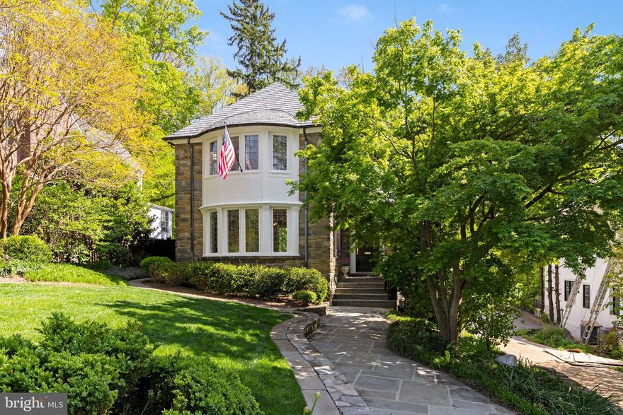 NEW PRICE!  Open Tuesday 5/17 from noon to 1:30.   Charming house on desirable Forest Lane has glorious wooded views from most rooms from its south facing rear rooms.   POOL, play space and terraces for outdoor entertaining and dining. Gracious and spacious living room  with adjacent sun rooms offers wonderful entertaining options while generous room sizes are conducive to both elegant or  casual living.   First floor has entry vestibule which opens to a large foyer with curved stair.  Dining room has beautiful bay window.  Recent renovations include NEW SLATE roof and replacement of copper gutters, as needed. Kitchen and baths were beautifully renovated.  Mudroom was added. Landscape and hardscape were improved with addition of privacy fencing, stone walls. Lighting, both interior and exterior, was replaced. Wainscoting and crown molding were added where needed. All materials used are of highest quality. Huge two car garage has extra storage.  Basketball hoop outside garage. Grassy play area just outside the fence next to the park.