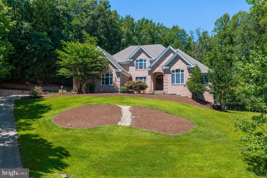 Welcome to 1602 Upton Scott Way !! A Spectacular All Brick Colonial Home on 1.28 Acres in the Water Priviledged  Community of Belvoir Farms. This Home has it all. Over 7000 sq feet of Living Space, 5 Bedrooms and 4.5 Baths, Enter to a 2 Story Hardwood Foyer with a Custom Turning Staircase. First Floor Master Suite with Tray Ceilings ,Sitting Room, Walkin  Closets, Double Vanities, Soaker Jacuzzi Tub and Separate Shower, Large Den / Study ,Formal Dining Room, Wine Fridge and wet Bar, Gourmet Kitchen with Granite Counters, Double Ovens ,Gas Cooktop and Custom Range Hood, Large Family Room off Kitchen with a Raised Hearth Brick Wood Burning Fireplace, Walkout to your Backyard Oasis !! Large Private Deck for Relaxing a Beautiful Updated Redone Heated Pool with New Decking, Diving Rock  and Major Hardscape. Rod Iron Fenced Rear Yard with Huge Custom Fire Pit and New Hot Tub.3 Large Bedrooms on the 2nd Level with Vaulted Ceilings .Fully Finished Basement with Raised Hearth Brick Wood Burning Fireplace. Full Kitchen and Bedroom with Full Bath. Main Level Laundry Room,4 Car Garage, Paved Driveway, Generator. This Home is Just a Pleasure to Show, Close to Restaurants, Annapolis Historic District ,City Dock and The United States Naval Academy, Good Commute to Washington DC, Baltimore, Fort Meade and NSA. *(Updates in Pool Area).* Pool Heater and Sand Filter in 2019, Pool Pump in 2020, Polaris vacuum and Pump 2019, Timers 2020, Pool Coping and Tile Replacement 2019, Landscape Lighting $7800.00 in 2019, Pool Patio and Deck Extension ,Walkway to Backyard ,Fire Pit, Rock River Bed Hardscaping,$100k in 2019,Hot Tub 2019 $ 8k,Water System Upgrade, All Brand New except for Containers 2018, HVAC 2 of 3 zones  replaced 2018 & 2019, Washer Dryer 2018, Main Floor Refrigerator 2019, Stand up Freezer 2019, Speakers thru out the Home and Deck $15,k, Magnolia Speaker and Internet System ,Including Fully Wired Ethernet Outlets & Mesh WiFi Network that reaches the Pool. $60k.