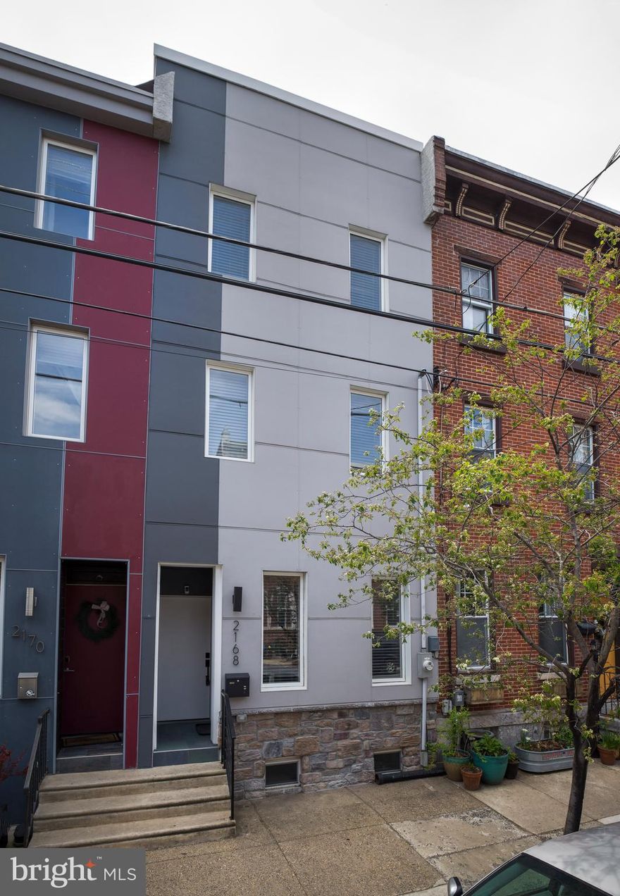 Welcome to 2168 E Cumberland St—this beautifully updated home in the heart of Fishtown was completely remodeled in 2022 and has everything you’ve been looking for. With 4 bedrooms, 3.5 bathrooms, and over 2,700 sq. ft. of space, there’s plenty of room to live, work, and entertain in style!

The first floor features an open layout with an oversized, light filled living room, a dedicated dining area, and a spacious kitchen outfitted with clean, modern design, ample cabinetry, and plenty of prep space—perfect for cooking, entertaining, or casual everyday meals. Just off the kitchen, you’ll find a composite deck that leads to a rare oversized backyard with plenty of green space—ideal for relaxing, grilling, or letting the dog run around. The first level is complete with a powder room. The fully finished basement provides incredible flexibility as a second living area, home office, gym, or playroom, plus extra storage space.

Upstairs on the second level, you'll find a spacious primary suite with a luxurious en suite bath, an additional bedroom and full bath, plus a dedicated laundry room. The third floor offers two more bedrooms—one with its own private deck and oversized closet—and another full bathroom.

Capping it all off is a stunning roof deck with panoramic, unobstructed views of the Philadelphia skyline.

Located just steps from the vibrant shops, cafes, and restaurants along Frankford and Girard Avenues, this home offers the perfect blend of modern comfort and walkable city convenience.

Don’t miss this incredible opportunity to own a turnkey home in one of Philly’s hottest neighborhoods!