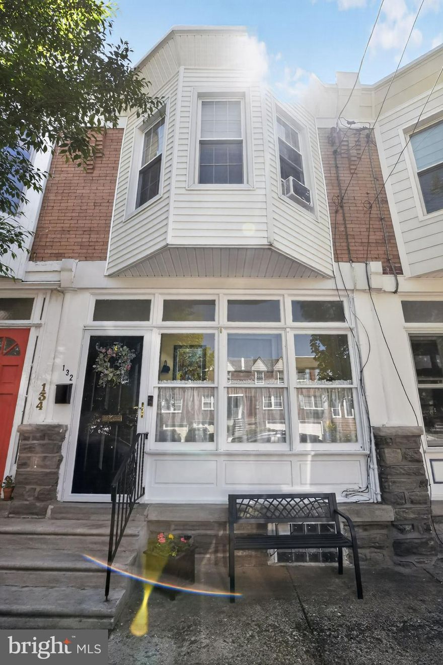 An inviting enclosed porch welcomes you, providing a serene transition into the home and the perfect setting for a quiet morning coffee or an evening glass of wine. Inside, the main level features an open flow between the living and dining rooms, both anchored by rich hardwood flooring and accented by refined woodwork. The updated kitchen is both stylish and functional, offering direct access to a private deck perfect for al fresco dining. The second floor has three bedrooms and a full hall bathroom.  The primary bedroom has a ceiling fan and a triple bay window allowing lots of natural light. A hall bath completes the second floor. For additional versatility, the finished lower level includes a dedicated recreation room, a convenient powder room, laundry facilities, and extra storage.  This gem offers a newer roof (2023) and replacement windows throughout the majority of the home. Situated in a premier location within Chestnut Hill, this charming home  offers an unparalleled walkable lifestyle. You are just steps away from the shopping, dining, and seasonal festivals along Germantown Avenue, as well as the regional rail for an easy commute. Outdoor enthusiasts will appreciate the immediate proximity to Water Tower Recreation Center offering tennis, pickle ball,  sport courts, ball fields and play ground, Valley Green, and the extensive trail system of the Wissahickon.