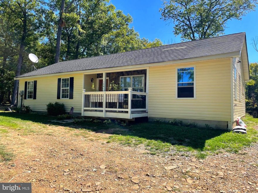 COMING SOON!! This 3 bed 2 bath ranch style home offers more than your typical ranch style house. It sits on 4.5 acres and has very little little restrictions. As you walk through the front door, you are greeted with an open concept floor plan with a large dining and kitchen area. The kitchen offers ample counter space and stainless steel appliances for all your cooking needs. Off to the right of the first room you will find a lovely sitting room or a perfect space for an at-home office. Off to the right of the kitchen you'll find one of the TWO laundry rooms! As you walk out the back of the kitchen, you will find a family room space with a wood burning fireplace that was just put in last winter and a deck off to the right. Picture yourself sitting in this room during the snowy winter curled up warm by the wood stove! Back the hall you will find the hall bath that has been completely redone, two bedrooms, and the owners bedroom with owners bathroom. This room has the second laundry room attached to it as well. Outside, there is plenty of storage space with one shed and another structure that can be used for more storage OR it does have well and septic hooked up to it and could be turned into another tiny home on the property! The opportunities are endless with this property, so don't miss out on the chance to make it yours!