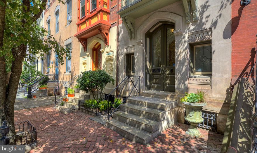 Breathtakingly beautiful and so very welcoming...plenty of room to spread out, or just be with those most important to you in your favorite space.  4 bedrooms and 3.5 baths.  Stylish, timeless, distinguished - this home is attributed to the famed architect Frank Furness with all with the extraordinary design and quality that simply can not be duplicated plus all the updates just where you want them.  Bathroom renovations are exquisite!  Lovely wet bar with fridge between library and living room perfect for entertaining.  Second floor laundry.  California Closets in owner suite.  Two zone AC.  Be impressed upon entering each room - with magnificent windows and soaring ceiling heights!  All of the desired conveniences for today from a large library complete with floor to ceiling bookshelves and fireplace (one of four all working in the home) to a completely private deck to even a spacious home sauna.  Basement level has separate outside entrance (an English basement), and a large storage area all in addition to the spacious exercise room complete with barre and full length mirrors and full bath - many possibilities for this space.  On a picturesque, tree lined, and non-through street with ornate and well cared for homes.  Located in Blue Ribbon Award winning Greenfield School Catchment zone.  So close to many of the city's best restaurants and amenities plus a short walk to Amtrak, UPENN, Comcast, Aramark, Fitler Club.  Just imagine life here!