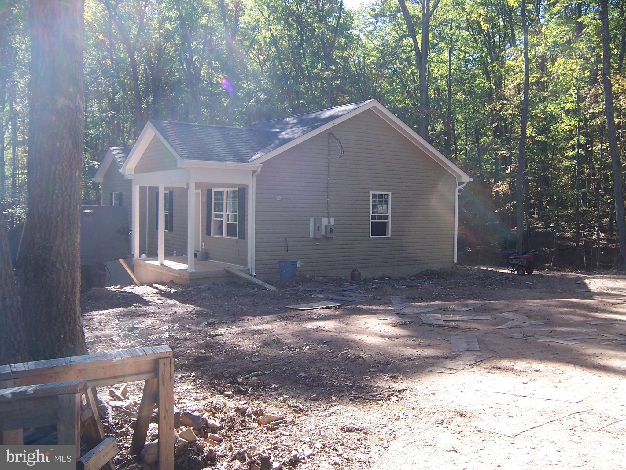 NEW RANCHER BEING BUILT ON TREEED 2 AC. LOT IN SOUTH BERKELEY CO. 3BEDROOMS 2 FULL BATHS WITH ROUGH IN BATH IN BASEMENT FOR LATER USE- WELL - SEPTIC - BUILDER WILL CONVEY WITH BERKELEY CO ENGINEERING AND BUILDING INSPECTIONS -CERTIFICATE OF USE AND OCCUPANCEY -ALONG WITH 1 YEAR BUILDERS WARRENTY- MAST BEDROOM WITH FULL BATH AND WALK IN CLOSET-KITCHEN WITH ALL APPLIANCES STAINLESS -BUYER MAY HAVE SOME PICKS IF NOT ORDERED AN WITH IN BUILDER COST-SUB -DIVISION IS IN ACTIVE IN HOA FEES -COVERANTS RUN WITH LAND- -WALK OUT BASEMENT- NO DECK INCLUDED IN THIS SALE -PRIVATE LAST LOT OFF ALLEY WAY-SMALL WET WEATHER CREEK ON LOT-2 OTHER BEDROOM WITH OPEN DINNING AND LIVING AREA-GREAT KITCHEN --WILD AN WONDERFUL WITH QUITE IN MOUNTAINS VA. LINE WITH IN 8 MILES