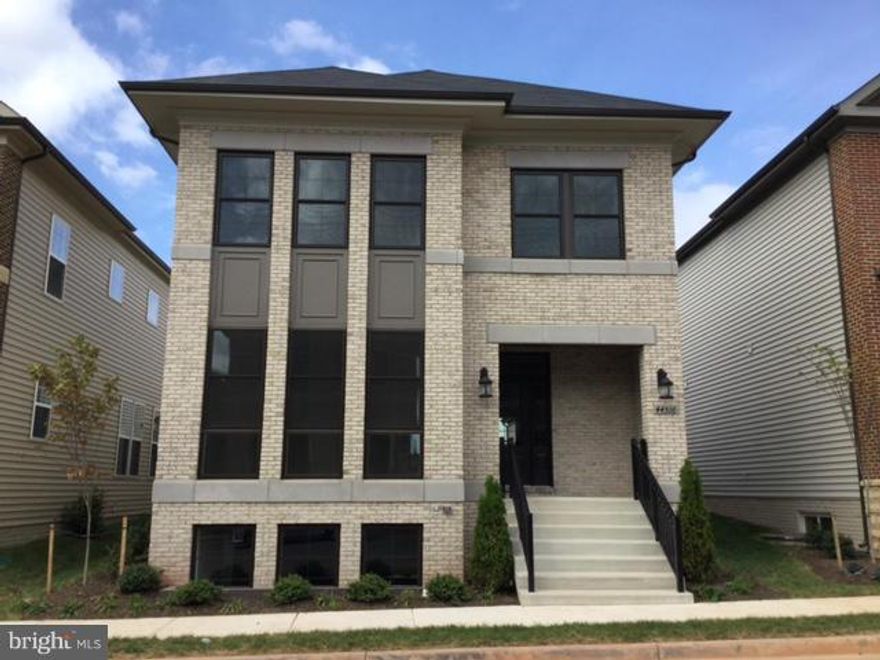 Live in One Loudoun! Wood floors on entire main level with contemporary open floorplan & spacious chef's kitchen. Step out to your private brick patio perfect for entertaining.  Bonus au pair suite/office w/ full bath located over the 2-car garage is perfect for guests!  Walk to the clubhouse/pool, restaurants, shops and Alamo theater.  Trader Joe's opening in a few months! No pets or smoking.