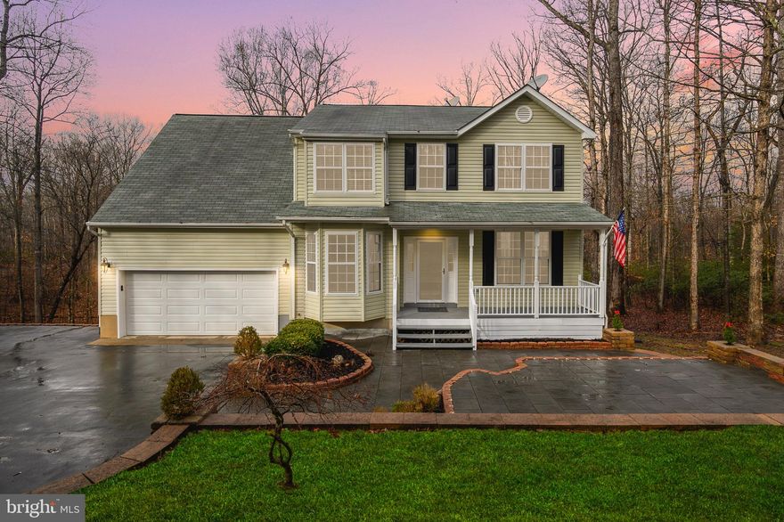 The patio and retaining wall as you walk up to this home, is absolutely stunning and is the perfect setting for a barbecue or just sit and enjoy a good book.  The home located on over 4 acres of land and just had a mini make over to include new carpet, the entire house was painted in a beautiful grey, the deck is now ready for some entertaining,  the front porch is waiting for a comfy chair, basement is finished with waterproof flooring,  a bedroom and full bath and beautiful french doors leading out to the deck or fire pit.  The entire home has been updated with new light fixtures to include a fan in all the upstairs bedrooms,  beautiful pendant lights in the kitchen,   new refrigerator, new washer/dryer, ecobee smart thermostat, touch free kitchen faucet and most important,  has high speed internet and cable through Comcast.
