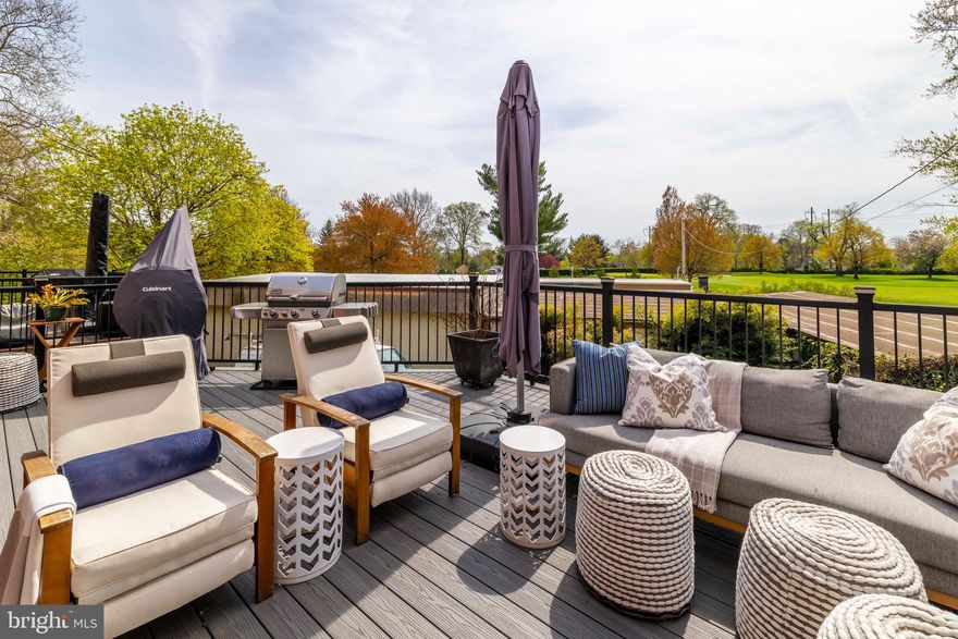 Multiple offers in hand. Offer deadline 5pm April 28th. Fabulous value in the City in move-in condition! Welcome to the secluded, cherry blossom lined streets of Belmont Village, a community association, with easy access to the expansive forests of Fairmount Park. This 1,600 sq ft, stone 3 bedroom, 2.1 bath home has been loved and updated over the past 17 years by the fastidious homeowners. Walking up to the front door you will notice a copper, standing seam roof over the bay window and entryway overhang and slate mansard. Once inside, an expansive living room is to your right and an eat-in kitchen is straight ahead with lots of room for a large dining table. Natural light floods the room from the huge French doors overlooking the amazing vistas over acres of the Bala Golf Course out of every rear-facing window. The stunning cook’s kitchen includes a fabulous island with a deep overhang for bar stools, gorgeous quartz countertops, a 4-burner gas stove with a warmer burner, a new refrigerator with a water and ice dispenser in the door, and a built-in designer storage closet. Head out to your expansive 28' x 16' maintenance free composite deck overlooking the golf course, an urban oasis, with an outdoor TV, Weber Genesis grill, Cuisinart heat lamp for those chilly nights plus all sorts of other goodies. Head downstairs to the handsomely finished basement with exposed beams which is all set up for a comfortable and cozy multi-purpose room for Superbowl parties, exercise, movie night, or whatever else your heart desires. Included on this level is a new powder room, large cedar closet, a utility room with a state-of-the-art combination boiler instant hot water unit, convenient wash sink and large storage closets, plus a full-size LG washer and dryer set. Head out the basement door to a shady fenced area under the deck for relaxing or a pet hangout with LED light sensors. Found down a private driveway with no egress behind the home, there is a 1-car garage with additional parking directly behind it for another car including very clever folding bollards to secure your space. On the 2nd floor, you will find three lovely bedrooms. Two of the bedrooms share a renovated hall bath with Kohler fixtures and a Kohler jacuzzi tub. The main bedroom has a new ensuite bath with Moen fixtures, an outfitted walk-in closet, an opening skylight, plus two additional closets with organizers. Other wonderful features are all front windows are new by Marvin, all exterior doors have been replaced or updated, and the basement has French drains throughout with a vapor barrier and sump pump so you will never have to worry about water issues. Mini splits throughout offer zoned air conditioning and supplemental heat. The automatic front lawn mower keeps the Zoysia grass looking sharp and the recent exterior painting and pointing is all up to date. Not to mention that commuters will love the neighborhood because of the easy access to City Center via the SEPTA train at the Bala station, and multitudes of services including grocery shopping, boutiques and restaurants are nearby.