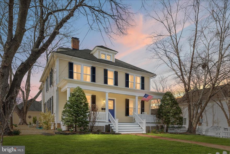 Live in the heart of historic Leesburg in this beautifully preserved and thoughtfully updated 1905 home on South King Street, just one block from the W&OD and downtown shops. Perfectly positioned on a coveted corner lot, this property offers walkable access to shops, grocery, restaurants, breweries, the W&OD Trail, and year-round town events—including front-row views of Leesburg’s iconic parades. This 4-bedroom, 2.5-bath home blends timeless character with modern upgrades. Original restored heart pine floors, functional leaded glass windows, solid oak pocket doors, and a built-in china cabinet showcase its historic charm, while updated HVAC and a renovated kitchen with new appliances, leathered granite countertops, tile backsplash, and a custom walk-in pantry with heated floors brings everyday comfort and functionality. The main level features formal living and dining spaces, a private office/library, and a seamless recently renovated family room addition with custom built-ins, a wood-burning stove, and new modern European style radiators and HVAC. Upstairs, you’ll find four spacious bedrooms, including a primary suite with a gas fireplace, spa-style bath, and generous closet space in every room and hallway. A finished attic with carpet, heating and air conditioning—hidden behind an original bookcase door—offers flexible space for an office, studio, playarea, extra bedroom, or retreat. Outdoor living is just as special, with a welcoming front porch, screened rear porch, new patio, additional side yard with fruit trees, and beautifully landscaped front and rear yards featuring mature trees and flowering gardens. Additional highlights include updated electrical systems and updated electrical service and panel to garage making it ready for EV charging systems. In zone for sought-after Cactoctin Elementary and Loudoun High School, with school bus stop in front of house (kids can wait for bus on the porch during raining days!). In short, rare opportunity to own a piece of historic Leesburg —where charm, location, family convenience, and lifestyle come together seamlessly. *Professional photos in MLS by  March 26. Active in MLS by March 27. Open House on both Saturday March 28 and Sunday March 29.