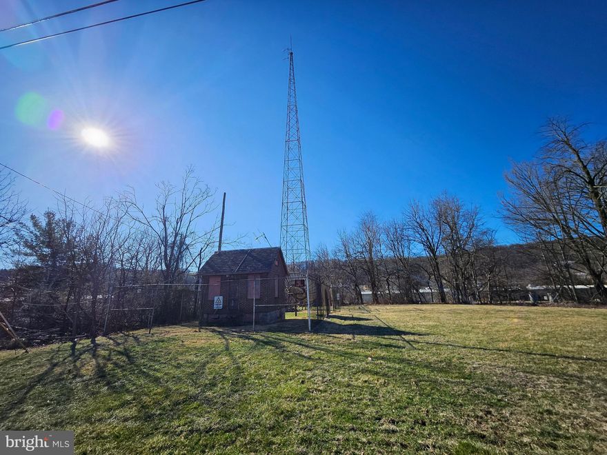 One-acre development site available for immediate sale. The site is an active radio station tower that broadcasts FM and AM radio. The tower has current long-term tenants with secure leases. This site can accommodate the addition of a monopole tower for mounting cellular antennas, microwave dishes, and other telecommunications equipment for increased revenue and higher profit margins. The site's R10 zoning allows uses such as single-family dwellings, group homes, houses of worship, private garages or carports, and many more. Located on Line Road next to Bravo Supermarket, Alpine Metal Products INC, with easy access to Route 78. Call today for additional information.