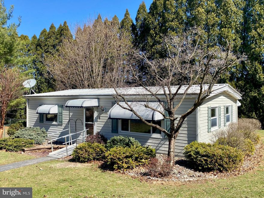 Open House Wednesday 3/26 from 4-5.  Stop by! Welcome to this adorable remodeled double-wide mobile home, offering a perfect blend of modern updates and comfort. Featuring two spacious bedrooms and an open floor plan, this home is designed for easy living and entertaining. With a bright and airy atmosphere, the home is bathed in natural light, thanks to large windows that flood the open kitchen and living room areas.  The home’s layout provides a sense of spaciousness while still maintaining cozy, intimate spaces. Every detail has been thoughtfully designed, with new flooring, fresh paint, and modern fixtures throughout. Outside, you’ll enjoy peace and privacy in a serene environment, making it a wonderful retreat.  Don’t miss the opportunity to own this beautifully remodeled mobile home—schedule your showing today! FYI: Lot rent is $480/mo which includes water  and common area ground maintenance. Potential Buyer will need to complete a credit application for the park which is on the MLS before their offer has been accepted. There is no fee for the credit application.