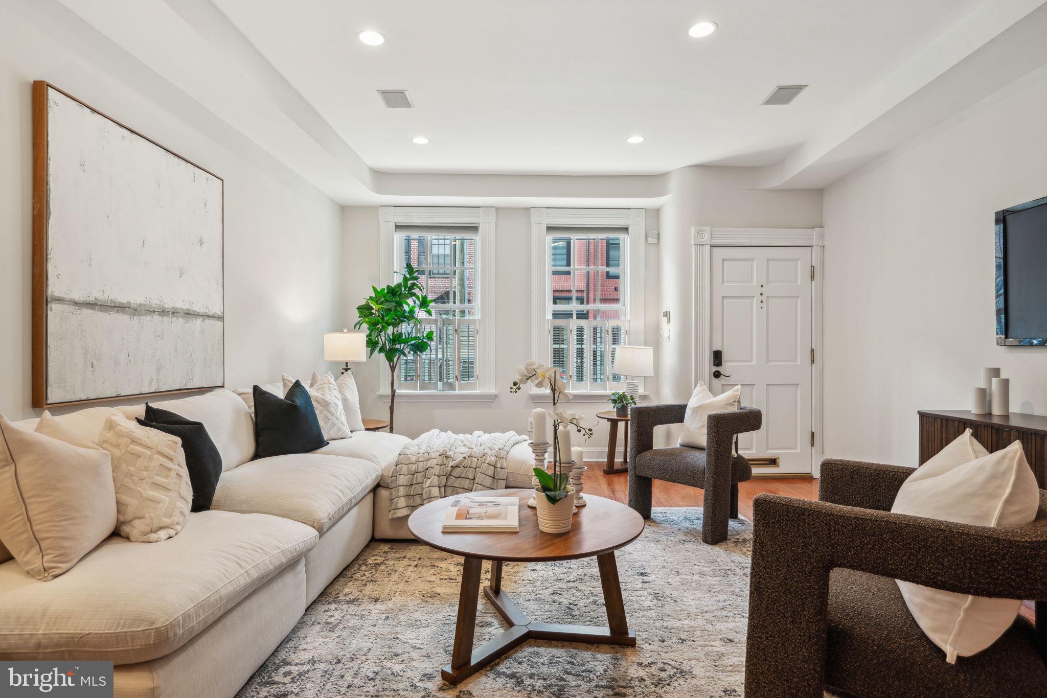 Historic Charm Meets Modern Living in the Heart of Queen Village... Welcome to 723 S. 2nd Street — a rare opportunity to own a historical stately home in the heart of Queen Village. Streets. This 5-bedroom, 3.5-bathroom home in one of Philadelphia’s most sought-after neighborhoods. Nestled on the corner of 2nd and Monroe Streets and located in the desirable Meredith School Catchment, this spacious property offers the perfect blend of historic elegance and modern convenience.
Step inside to an open and airy living and dining area, ideal for entertaining or cozy nights in. You'll be captivated by six original fireplaces throughout the home, adding warmth and character to each level. The kitchen is well-appointed and seamlessly connects to one of the home’s four private outdoor spaces, perfect for al fresco dining, morning coffee, or simply unwinding. Just off the kitchen, a butler’s pantry with a wet bar and wine fridge adds style and function — perfect for hosting or keeping everyday essentials tucked away.
With five generously sized bedrooms, including a full-floor primary suite, there’s room for everyone — whether you need extra space for a home office, guest room, or growing family. A convenient upper floor laundry area makes everyday living that much easier. Hardwood floors flow throughout the home, tying each space together with warmth and continuity. The spacious, unfinished basement offers excellent storage potential and room for future customization. Enjoy multiple balconies, a rear patio, and a rooftop deck with both city and waterfront views — rare finds in the city that truly elevate your living experience.
Located just steps from neighborhood favorites like Head House Square, South Street, and the Delaware River waterfront, this home places you in the center of Queen Village’s vibrant dining, shopping, and community scene. Easy access to public transportation and major highways adds convenience to this charming address. Owner is also offering credit towards 1 year of prepaid parking in nearby garage.
Don’t miss your chance to call this distinctive and spacious Queen Village residence home!