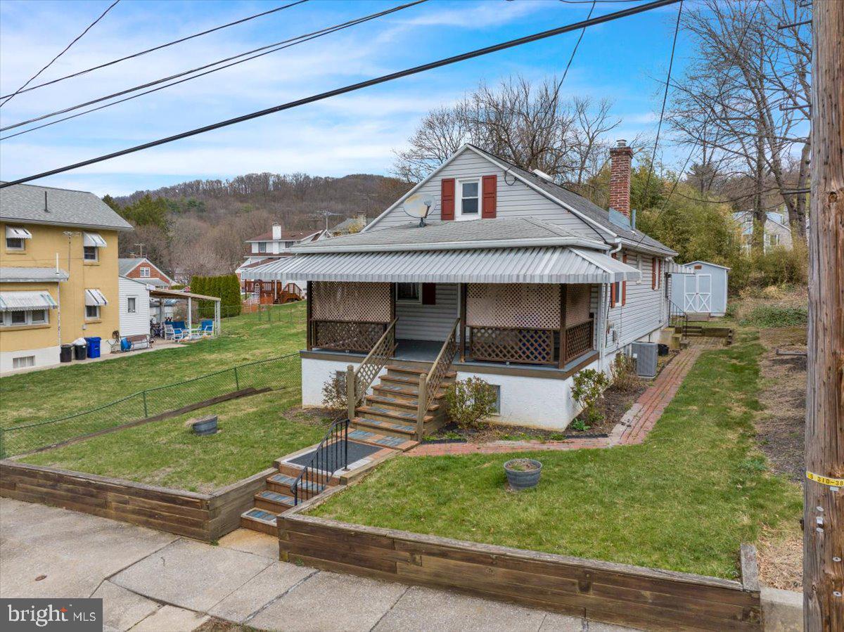 Welcome to 3221 Gray Street in Laureldale Borough. This Muhlenberg Schools one story no steps ranch style home offers one bedroom, one bathroom and 884 square feet of move in ready living area. Step up onto the wonderful covered front porch - a great spot to converse with friends while enjoying your favorite summer beverage that leads inside to the spacious front living room that leads you down the hallway to the kitchen passing the full tub shower bathroom and bedroom on your way. Kitchen features include full eat-in, oak cabinets, gas range and refrigerator included. A rear laundry mudroom offers great pantry storage space and leads you to the rear 2 tier rear deck/patio - a great spot for a summer BBQ. All this plus a full basement with workshop area, hi efficiency gas HVAC and close proximity to schools, parks, shopping, dining and more! Schedule your tour today!