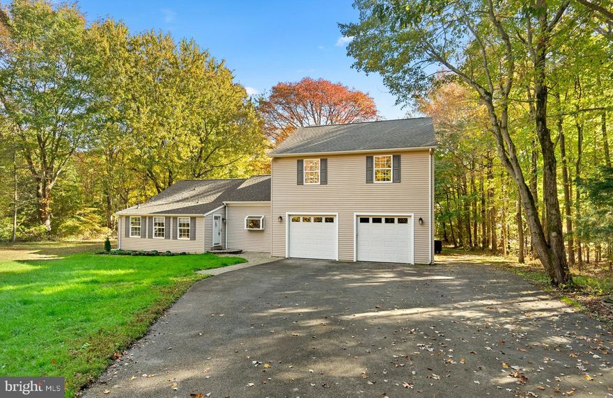 BACK ON MARKET WITH New Roof, New HVAC, Updated Kitchen and Bath and Landscaping!  Colonial style residence with a winter view of the Chesapeake Bay in Shady Side is situated on a tree-lined 1 acre homesite with a delightful pond.  This home offers LVT flooring, a foyer opens to a living room with a brick surround fireplace with a wood burning insert, a dining room, and a well-equipped kitchen complete in a neutral color palette.   Upgraded cook’s kitchen features a greenhouse bay window, crisp white raised frame cabinetry, quartz counters, a slate stainless steel suite, a peninsula infinity island with breakfast bar, and an open breakfast room.  The main level owner’s suite presents a sitting area or office, multiple closets, a breezy ceiling fan, access to the deck, and a private bath with a double vanity and an oversized  frameless glass shower with statement subway ceramics.  Community is in a great location near all of your everyday needs, community with netted swimming area, boat ramp, pier, picnic area, parks, South Creek, Deep Creek, and West River.  NEW PHOTOS TO FOLLOW.
