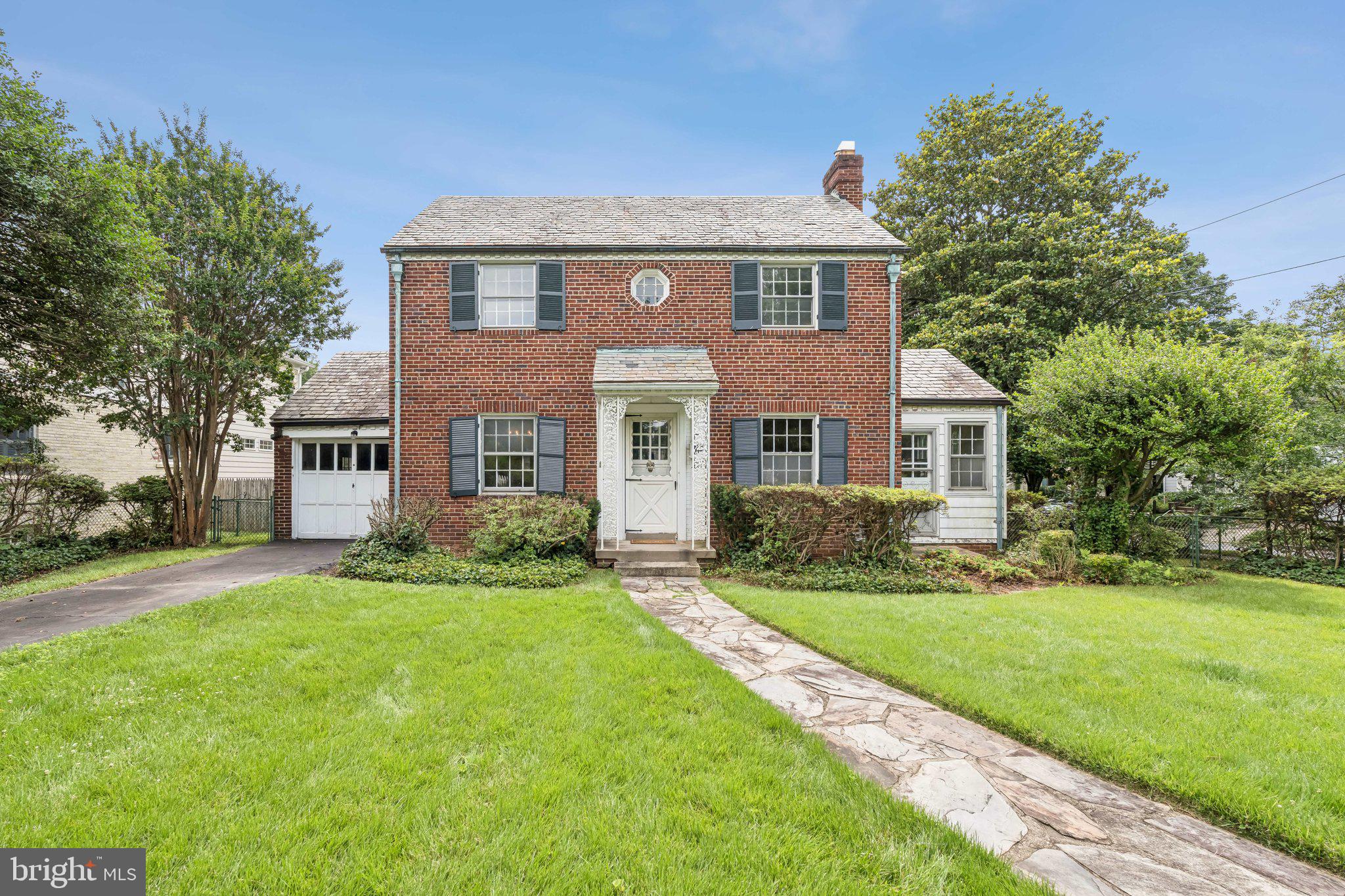 Nestled on a corner lot in the heart of Chevy Chase, this 3-bedroom, 1.75-bath colonial is brimming with character and untapped potential. Built in 1939 and lovingly maintained by one family for generations, this home exudes classic charm with a brick exterior, original slate roof, and hardwood floors throughout. Inside you'll find bold vintage wallpaper in excellent condition (a perfect reminder that the best trends always come back in style), a cozy wood-burning fireplace, an enclosed side porch, formal dining room and a traditional layout. In addition to a full bath on the upper level and half bath on the main level, there’s also a quarter bathroom in the walkout basement, along with an attached 1-car garage and fenced-in yard. Hot water heater (2024). Gas furnace (2017)
Located within the tight-knit community of the Village of Martin’s Additions, residents enjoy a strong neighborhood spirit, an active listserv, a regular email newsletter, neighborhood maintenance and contractor services plus numerous social events throughout the year.
This unbeatable location is just one block from a variety of beloved local businesses—including La Ferme restaurant, Olympia Cafe, a barber shop, Brookville Market, Brookville Pharmacy, a dry cleaners and much more. It’s also a commuter’s dream, with the DC line less than a mile away and easy access to bus routes and major thoroughfares.
Outdoor enthusiasts will appreciate Chevy Chase Local Park, offering a baseball field, tennis court, multi-use field, and playground— great for all ages.
Sold strictly as is, this home is perfect for those looking to create something truly special. Whether you're an investor, renovator, or visionary homebuyer, this is your opportunity to personalize a piece of Chevy Chase history in one of its most beloved neighborhoods.