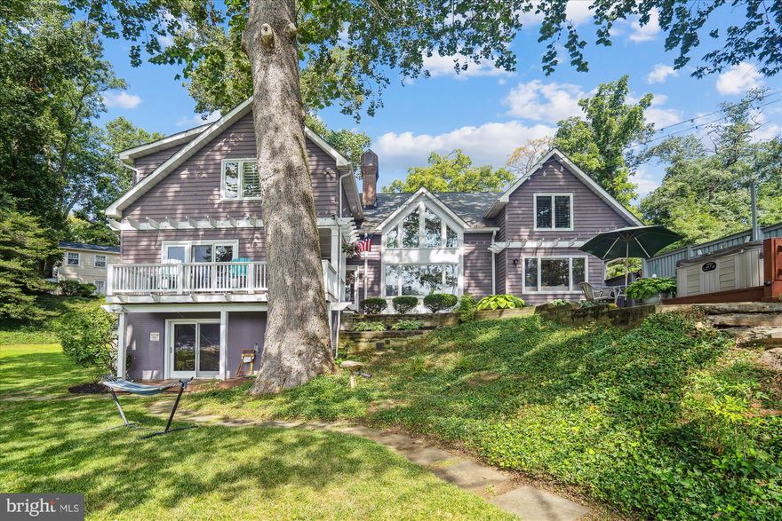 Within walking distance to West Annapolis - but outside of the city limits- you’ll find this welcoming home with extensive water views and private pier.  Located on Weems Creek just minutes away from the Severn River, it overlooks the deep water with all the pleasantries a nature lover will enjoy.  This home boasts of an open floor plan with water views from almost every room, high ceilings and wood floors. The finished lower level makes for the perfect entertaining area, in-law suite, or guest quarters with wet bar, bedroom, full bath, and sliders to the waterfront and hot tub. A separate yard with a basketball area allows for additional space to spend your time. Over 3500 sq ft of living space, 5/6 bedrooms 4.5 bathrooms, this home truly has it all! There is a storage shed by the water, making it convenient to keep equipment at the dock.  The location is convenient to Route 50, Washington DC, and Baltimore. Come enjoy this beautiful setting and all the Annapolis waterfront lifestyle has to offer.