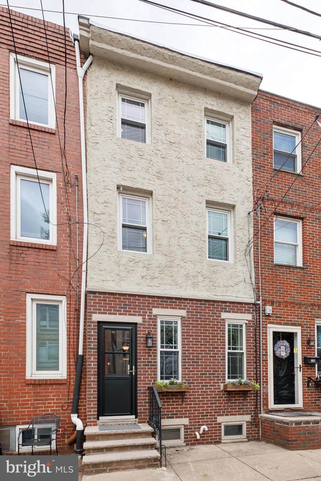 Welcome to 126 Greenwich St, a stunning 3-story home with central air, nestled in the desirable Pennsport neighborhood of South Philadelphia. This home offers a perfect blend of space, style, and modern updates, featuring two large bedrooms, two full bathrooms, a bonus loft room, and a fully finished basement—everything you need and more!
As you enter, you’ll be greeted by an open floor plan with hardwood floors, and recessed lighting. The kitchen is a chef’s dream, complete with stainless steel appliances, granite counters, a pot rack, and a breakfast bar for two. Just off the kitchen is an outdoor space perfect for a small patio, ideal for grilling or gardening.
The second floor features a spacious bedroom with great closet space and an oversized, recently renovated bathroom with a double-sink vanity. The bonus loft room, with soaring ceilings and an abundance of natural light, is currently used as a home office and also houses the laundry area with a newer washer and dryer.
The primary suite occupies the third floor, featuring a large bedroom with ample closet space, a newly remodeled bathroom, and additional loft space. The third-floor loft overlooks the office and is adorned with beautiful woodwork, exposed brick, and a large window that fills the space with natural light—ideal for a plant room, reading nook, or home library.
The fully finished basement adds even more living space, offering endless possibilities for a family room, home gym, or guest room. The basement includes built-in shelving and a separate mechanical room.
Located on a quiet, low-traffic street, you’re just steps away from parks, playgrounds, shopping centers, and public transportation. With easy access to I-95, NJ bridges, and the stadiums, the location couldn’t be better. Enjoy local dining favorites in Pennsport, or explore nearby Queen Village and Passyunk for even more options.
This well-maintained, move-in-ready home is full of character and modern updates. Don’t miss your chance to own a home in one of South Philly’s most desirable neighborhoods—schedule a showing today!