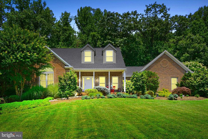 **OPEN HOUSE HAS BEEN CANCELLED, UPON SELLERS REQUEST.** **AN OFFER HAS BEEN RECEIVED. DEADLINE FOR ALL OFFERS IS 7/16 AT 9AM** Introducing 1906 Musgrave Ritual Dr., a pristine, contemporary Cape Cod home nestled on a serene 1.74-acre lot in the peaceful Sherlock Holmes Estates. Surrounded by natural beauty and protected woodlands, this property offers an idyllic and tranquil retreat. From the stunning curb appeal to the meticulous interiors, this home is truly captivating. The open floor plan is anchored by rustic hardwood floors, creating a warm and inviting atmosphere. A beautifully appointed kitchen sits adjacent to the formal dining area, ideal for family meals or entertaining guests. The first-floor master suite offers convenience and privacy, while two spacious bedrooms upstairs provide ample room for family or guests. Each bedroom boasts large closets, catering to all your storage needs. The laundry room is conveniently located on the main floor, making everyday chores a breeze. The home offers a thoughtfully designed office space in the basement, ideal for remote work or study. The basement also hosts a living area, a bedroom, a full bathroom, and a built-in coffee/cocktail bar - perfect for entertaining or relaxing.  An extra area upstairs, complete with a cozy gas fireplace and additional dining or living space, amplifies the comfort of this remarkable home. Storage solutions abound with multiple pantries in both the kitchen and laundry room. An oversized three-car garage caters to all your parking and storage needs, while a Ring doorbell system and motion sensors off the deck enhance the property's security. Step outside to an exquisite outdoor area featuring a heated pool and charming bridge walkways, leading to a large fenced-in private yard with a firepit. Enjoy quiet evenings from the screened-in porch overlooking the picturesque garden, or host lively summer parties for your family and friends - the choice is yours! Located near Liberty Reservoir and its inviting trails, this home offers convenience, enjoyment, and tranquility. If you're looking for a home that combines contemporary living with the peace of country life, this is the one. Don't miss out on this unique opportunity - schedule your tour today!