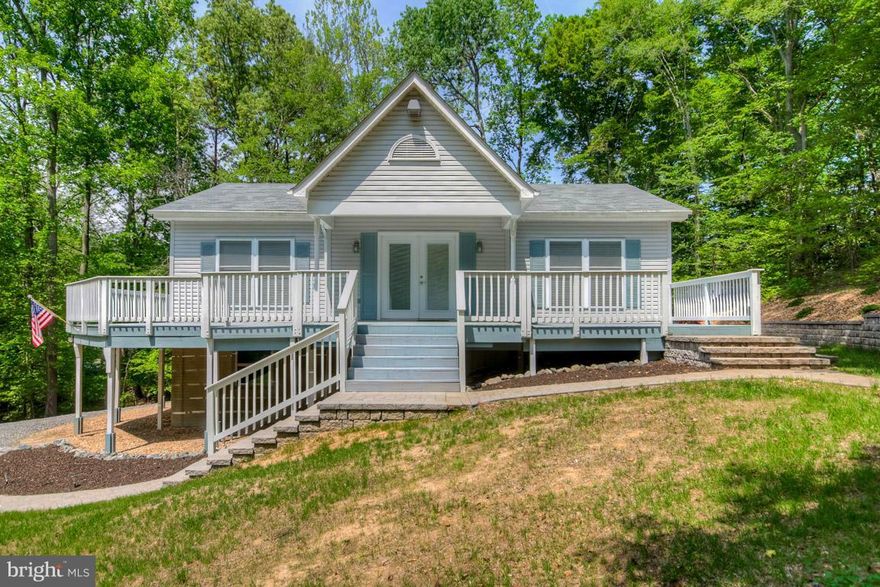 This beautifully updated home sits on over 5 acres of panoramic wooded view. 2600 sq ft of heated/cooled space includes unfinished basement with room for apt or in-law suite The main level has been been remodeled with all the finishing touches Pasture land is perfect for agriculture or livestock  Several outbuildings for all your storage needs .See docs additional info and DON'T MISS THE VIDEO!!