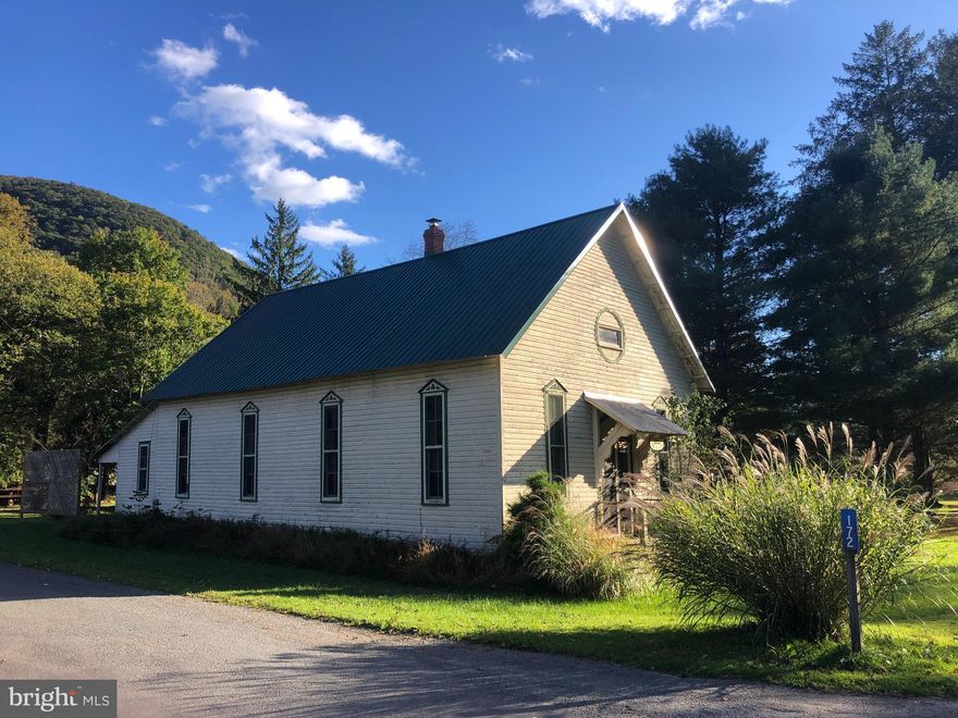 FULLY FURNISHED historic 5-Bedroom converted church near Ricketts Glen.  Sleeps 20-25.  Perfect for Large Groups, Outdoor Enthusiasts, and Investors in the heart of Jamison City and State Game Lands #13, the Largest State Game Lands in Pennsylvania.  A true Unicorn of a property.

"CHURCH CAMP" -this 5-bedroom, 2-bath converted church combines rich history with natural beauty, offering the perfect weekend getaway.  It's been used as a cabin for the past 75+ years.  Originally the first church of Jamison City during its boomtown era, this home retains its historic charm with its original wood architecture and stained glass windows, while boasting modern amenities like updated bathrooms and comfortable accommodations for 20-25 guests.  Fully furnished including the current beds and two dining room tables.  Most antiques and housewares will stay including the original Church Organ and the two Church Pews. 

Located on the edge of Pennsylvania State Game Lands #13, this property is a dream for fishermen, hunters, hikers, and anyone who loves the great outdoors. Take a quick walk up the street and explore nearby waterfalls along the East Branch of Fishing Creek like Sullivan Falls, Lewis Falls, and Horseshoe Falls, or take a short trip over the mountain to Ricketts Glen State Park for more adventures. 

Inside, enjoy the cozy atmosphere of a hardwood cabin with vaulted ceilings and space galore.  The "Bunk Room" includes seven bunk beds and is truly one-of-a-kind.  Whether you’re renting it out, hosting large gatherings, or just seeking a tranquil spot surrounded by wildlife, this property offers endless potential. Don’t miss your chance to own a piece of history in this quiet, wildlife-filled haven.  Schedule a showing today! 

** Both Sellers are licensed PA Real Estate Agents**