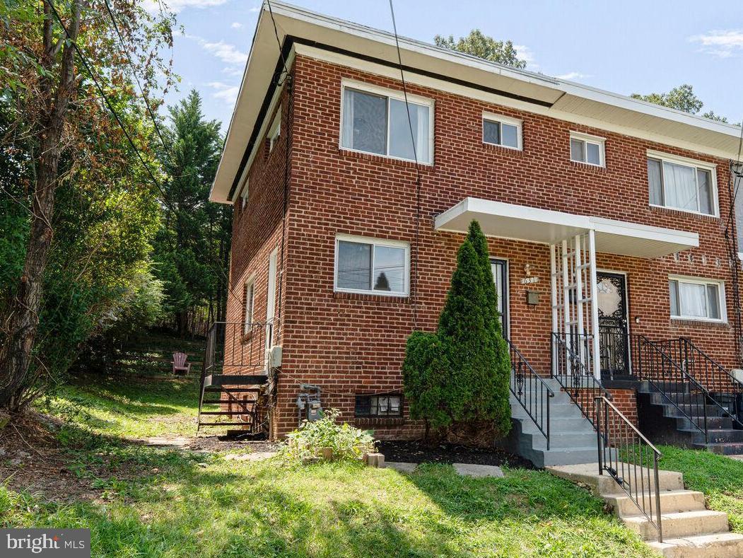 Tucked away in sought-after Glassmanor community, just a mile from the DC state line, this 3-bedroom, 1.5-bath end-unit townhouse enjoys superb access to all that Washington, DC, and Alexandria have to offer. Freshly painted in 2025, the bright and airy interior opens with a welcoming sitting and dining area, complete with updated flooring and door leading to the rear deck, ideal for relaxing or entertaining. The kitchen features crisp white cabinetry, granite countertops, tile flooring, a stylish backsplash, gas cooking, and a separate entrance leading to the side yard. Upstairs, you will find two generously proportioned bedrooms, each with ample wardrobe space, along with a shared full bathroom featuring a bath with overhead shower. The lower level features a spacious rec room with a laundry area and separate storage closet. A third bedroom on this level, with a nearby powder room, offers a versatile space perfect as a guest accommodation, an in-home office, or playroom. Step outside to the rear deck, where stairs lead down to a spacious backyard complete with a storage shed and mature trees provide a pleasant shaded retreat. Convenient street parking is available right in front of the home, and recent updates include a newer water heater (2025) and HVAC system (2021). Outdoor enthusiasts will appreciate nearby Oxon Cove Park & Oxon Hill Farm, which features a scenic 4-mile trail, picnic areas, historic exhibits, and live animals, all set near the Potomac River. This home’s prime location is also perfectly positioned just minutes from Tanger Outlets, less than a mile to DC, three miles to National Harbor, and within five miles of all that Alexandria has to offer. Don’t miss this!