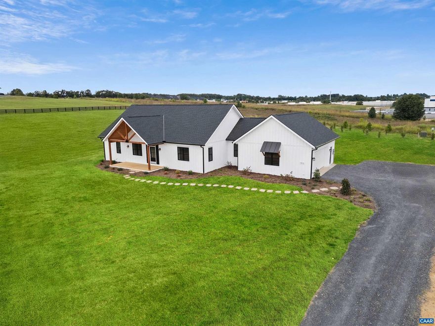 Top-notch new construction, commanding views of the Blue Ridge Mountains, and a convenient location make this a great offering to the marketplace. This spectacular home combines traditional craftsmanship with modern innovations, using advanced building technologies. This solid, stunning, and sustainable transitional design incorporates modern building science to deliver long-term energy savings through insulated concrete construction, along with a Broan energy recovery ventilation system and a smart HVAC system, ensuring real comfort all year long. High ceilings and an open floor plan with large Pella windows create wonderful natural light and far-reaching vistas in every direction. High-quality construction and timeless design provide energy efficiency and low-maintenance living, all in one-level living. The land is open with rolling, level topography. Coyner Springs Park is nearby. Features include a gas fireplace, locally handmade mantel, engineered, wide-plank white oak flooring, Pella windows, a large soaking tub, and more. Pull-down stairs to attic storage from the main living area and garage. Country living with fabulous convenience.,Maple Cabinets,Painted Cabinets,Solid Surface Counter,White Cabinets,Wood Cabinets,Fireplace in Living Room