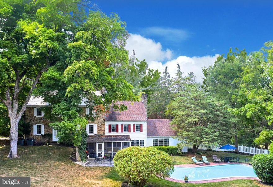 Proudly introducing Running Springs Farm, a legacy property offering total privacy, timeless sophistication and endless views across 7.5 lush acres. Situated in the prestigious Jericho Valley area of Upper Makefield Township lies this historic homestead.  Established in 1740, this classic Bucks County property seamlessly blends historic charm with modern luxury and is now available for the first time in over 50 years. As you arrive, a grand circular driveway welcomes you, leading you to a breathtaking property that whispers of timeless sophistication. The home’s custom kitchen, comprised of tasteful built-ins, exposed beams, top-of-the-line appliances and custom cabinetry, provides charming views of the outdoor patio, spring house and in-ground pool. Host dinners and entertain in the formal dining room which opens to the lovely  screened-in porch and outside terrace where you can enjoy all four seasons of Bucks County landscape.  Meander from the formal dining room and enter a cozy keeping room (the original kitchen) with an oversized wood burning  fireplace. Beyond this, there is a large playroom/storage area.  The first floor is completed with a  laundry room featuring tons of storage, a sink, a bar area, and a powder room. Climb the stairs or enter the  second floor through the original entrance way. Here you will  find an elegant living room with fireplace. This floor also consists of a private & stoic library/office with a fireplace, and 2 lovely bedrooms, each with their own character and charm.  A full bath completes the second floor. Finally, as you reach the third level you will find the  third bedroom and powder room along with the master bedroom which has beautiful bleeding pine hardwood flooring  and an oversized elegant bathroom. This unique property is a must-see, and it offers rich history as well. Stories intertwine with legends, such as alleged encounters between one of the homestead’s former owner and Marilyn Monroe within its walls, lending an air of mystique to its past. As you tour the grounds you will find an original large Bucks County Bank barn with stables and a hay loft. The barn leads to two large pastures which could accommodate your horses and farm animals. You can safely store your cars in the detached two car garage. Today, this exceptional estate stands as a testament to timeless elegance, with sensational allure and bountiful surroundings. Located on a picturesque road  across from a  large preserved farm, less than 10 minutes from New Hope, within the esteemed Council Rock School District, Running Springs Farm provides easy access to premier shopping, dining, and entertainment destinations. Its proximity to major commuter routes ensure convenient access to major hubs such as Philadelphia, Princeton, and New York. This is a true, once-in-a-lifetime opportunity to own a rich piece of Bucks County history on a quintessential country road.  (Seller is a licensed agent.)