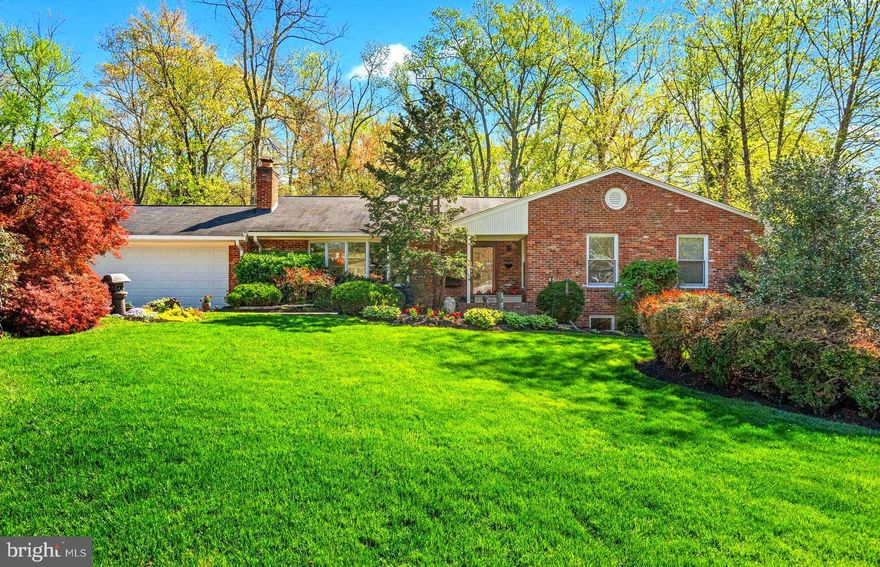 The perfect blend of curated design and modern convenience awaits in prestigious River Bend Estates. Idyllically positioned along the scenic George Washington Parkway—just steps from the river and trail—this custom antique brick home sits prominently on a meticulously landscaped half-acre lot backing to protected parkland.

Thoughtfully designed for today’s lifestyle, this exceptional residence showcases quality craftsmanship throughout. Inside, you’ll find gleaming hardwood floors, designer paint tones, recessed lighting, crown molding, chair rail detailing, and Pella windows that flood the home with natural light.

The stately living room features a classic wood-burning fireplace and a sparkling bay window, while the elegant dining room impresses with dramatic floor-to-ceiling cathedral windows that seamlessly connect indoor living with the serene outdoor gardens.

The renovated and expanded kitchen is a chef’s dream, offering lovely inset cherry cabinetry, designer stainless steel appliances, and granite countertops with a custom island—perfect for entertaining.

Unwind in the inviting den with its cozy gas fireplace and picture window overlooking the brick patio. Also easy access to the oversized two car garage. 

The main-level primary suite is a true retreat, highlighted by an architecturally designed cathedral ceiling with skylights and a beautifully appointed bath. Two additional  bedrooms and a renovated hall bath complete the main level.

The finished lower level provides exceptional flexibility, featuring a comfortable family room, an additional large bedroom plus an office/guest bedroom, a full bath, and an exercise/game room area with walk-out access to the yard. A laundry room and expansive storage room add everyday convenience.

Step outside to discover a private oasis. The grounds are beautifully landscaped with slate and brick walkways, double paver driveway, and a charming stone arbor. The backyard retreat includes multiple patio areas, manicured gardens with an underground sprinkler system, and an in-ground stone fire pit—ideal for gathering with family and friends. A garden shed and fully fenced yard with a private gate opening directly to Fort Hunt Park complete the setting.

Ideally located near the GW Trail, Fort Hunt Park, Cedar Knoll Restaurant, and historic Mount Vernon Mansion, this home also offers easy access to major commuting routes, Metro, the airport, Old Town Alexandria, and Washington, DC.

Please see sellers detailed list of all renovations and improvements in document section
This is a rare opportunity to own an exceptional home in a most desirable neighborhood!