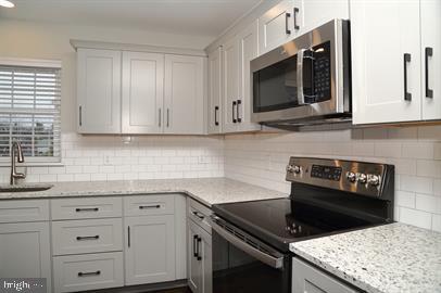 This breathtaking apartment is located at Dickinson's Corner in the heart of Quarryville, PA. Close to 472 and 222, this former corner grocery store and apartment building has been restored and transformed. Units feature refinished hard wood floors, exposed beams and brick, new kitchens with stainless steel appliances, central heat and AC, washer/dryer in unit, and secured access. Water, Sewer, Trash, and off-street parking included. Professionally managed with 24/7 emergency maintenance, online rental payments, and electronic leasing. Unit 6 features two bedrooms and one bathroom.