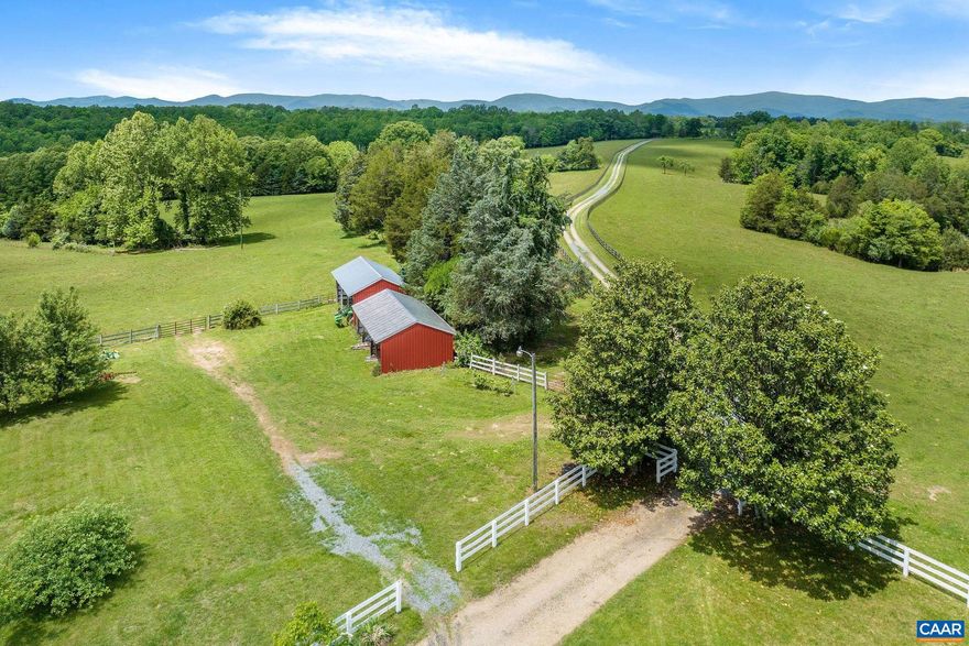 This beautiful 124 acre Albemarle farm with magnificent Blue Ridge and Southwest Mountain views, located just 10 min. from the Route 29 corridor and the C?ville airport, offers the ideal setting not only for those looking for convenient amenities, excellent vineyards, & all that Charlottesville has to offer,  but also those seeking easy access to DC, NY & other major cities. Comprised of approx. 50% open pasture encircled by privacy-enhancing hardwood forest, this stunning property is NOT IN CONSERVATION EASEMENT but does enjoy land use status for cattle. With several streams and springs, a large farm equipment building, storage shed, & fencing and cross fencing, it is well suited for horses, livestock, crops, and hay. Flanked by large estates and abutting Chris Greene Lake Park, the land is a tranquil haven for wildlife with lovely views of the farm?s open fields & gorgeous sunsets. This property also offers a charming 5 bedroom, 3.5 bath Cape style home w/main level primary, whole house generator, 2 car garage, & light-filled, spacious rooms. A great opportunity to create a family compound or live in the current home while creating a new estate on one of the several outstanding building sites.  5 theoretical division rights.,Formica Counter,Wood Cabinets,Fireplace in Family Room