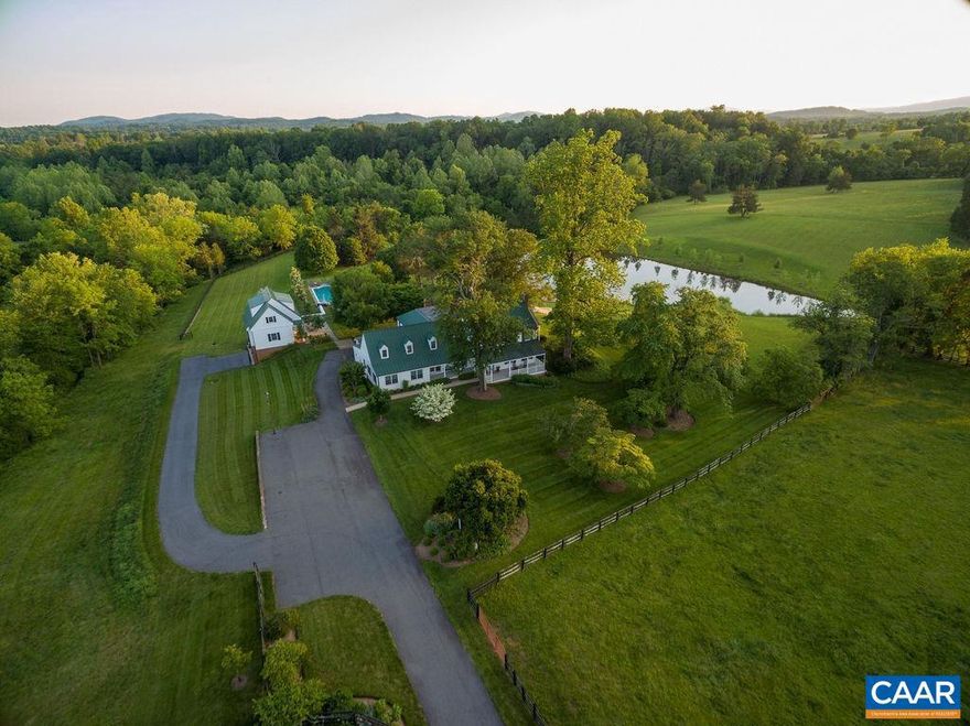 An exceptional Farmington Hunt offering, "Willowbrook" is a rare opportunity to own a piece of Albemarle County's rich rural history in a prime location. Held in conservation, "Willowbrook" is comprised of 24.2 pastoral acres located less than 10 minutes from Farmington Country Club & Barracks Road Shopping Center. Meticulously restored & renovated, the 6112sf main house features 5 bedrooms & 5.5 baths. The detached garage/studio includes: exercise room, full bath, party room, pool bath, outdoor shower, 2 parking bays & storage. The grounds have been extensively updated w/ new hardscaping & landscaping to compliment the bucolic setting. Inground pool, stocked pond w/ new dock, 3 stall stable w/ tack room & wash stable, 2 fenced pastures & "secret meadow" complete this special offering.,Marble Counter,Painted Cabinets,White Cabinets,Wood Cabinets,Fireplace in Dining Room,Fireplace in Living Room,Fireplace in Study/Library