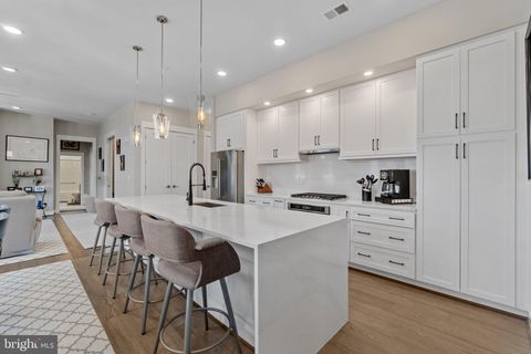 Photo of 5 Stationmaster Street SE #400, LEESBURG, VA 20175 (MLS # VALO2117286)