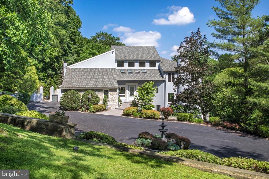 Modern elegance is in full display in this exceptional 5 bedroom, 7.1 bath residence in prime Gladwyne, set amidst 3 private landscaped and wooded acres in the Main Line s coveted Northside Mill Creek region. The experience begins with a long winding gated drive that proceeds through stunning grounds to a large circular drive, covered carport, and 5-car attached garage. A fabulous outdoor patio, 39 x18  pool, regulation-size tennis court, and multi-tiered terraces round out the resort-like ambiance of this contemporary gem and ultimate family oasis. The front door opens to a sensational 2 1/2-story entry hall/gallery awaits, likening a modern art museum with soaring ceilings and expansive wall space for displaying artworks. Marble floors, a striking curved staircase, drop chandelier, and generous windows and skylights further dramatize this impressive space. The main level is designed for living and entertaining at its best. The gracious floorplan is highlighted by airy ceilings, wood and marble flooring, and generous glass inviting abundant natural light. Beautiful nature views are enjoyed all year round, from every vantage point. A spacious living room, dining room and family room set a tone of comfortable elegance for hosting and relaxation. The sleek, striking kitchen is fully equipped for the cook with granite counters and premium Miele appliances, with an open breakfast room, soaring ceilings and massive window wall bringing the outdoors in. On the second floor, an expansive master bedroom suite with a fireside sitting area, dressing room, and deluxe marble-clad spa bath provides a serene retreat. Three additional large bedrooms - one with a loft space, all with en-suite baths and ample closets - provide private quarters for family and visitors. An office/library features lovely built-ins and elevated views. The full, finished lower level boasts multiple entertainment areas, a bar, dance floor, family room, plus an office area and guest/au-pair suite with kitchenette. Beyond the gorgeous natural surroundings, you ll enjoy living in close proximity to the village center of Gladwyne, shopping and dining, top local schools, all major transportation routes, and Center City.