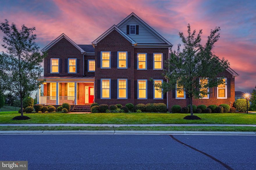 This exquisite colonial-style home features a total of seven bedrooms and six full baths with nearly 7,000 square feet of finished living space and a thoughtfully designed floor plan. Situated on a nearly half-acre corner lot, this home provides privacy and tranquility while remaining close to all the amenities of this sought-after community.   Upon entering, you're greeted by a grand foyer leading to an open and airy layout, highlighted by a beautiful winding staircase. Gleaming upgraded Acacia hardwood floors seamlessly connect each room. The incredible gourmet kitchen is a chef’s delight, with new sleek quartz countertops, high-end stainless steel appliances, an expanded center island with built-in storage, and abundant upgraded cabinetry. The sunroom, with east and south exposure, fills the space with natural light.

The spacious family room, warmed by a cozy fireplace, offers a place for rest and relaxation and flows seamlessly into the formal living and dining rooms, making it perfect for entertaining guests. For added convenience, the main level includes an in-law suite with a full bathroom, ideal for accommodating guests or family members. The home office, situated at the front of the house, provides a quiet and private space perfect for working from home.

Ascending to the upper level, you will find the luxurious primary suite, which features a large sitting room, dual walk-in closets, and a lavish bathroom complete with dual granite top vanities, a soaking tub, and an oversized frameless glass shower. The four additional bedrooms on this level are generously sized, offer ample closet space and ceiling fans for added comfort.  Two of the bedrooms share a jack and jill bathroom with upgraded granite vanities and tile flooring, and the others feature an equally upgraded private ensuite.  The laundry room is conveniently located on the bedroom level.  The HVAC on the upper level was recently replaced, enhancing this homes energy efficiency and providing hassle-free living for years to come!

The fully finished basement is an entertainer’s dream. With direct access to the backyard and deck, hosting gatherings is a breeze. This space features a recreation room with a second gas fireplace, a media room, a custom wet bar with a full size refrigerator and dishwasher, a bedroom, a full bathroom, a gym room, and ample storage. The recreation room's fireplace adds a cozy ambiance, making it an inviting place to relax and enjoy.

Nestled on a beautiful corner lot with no neighbor on one side, this home offers privacy and tranquility. The custom deck and south-facing backyard is bathed in sunlight, making it perfect for outdoor activities and relaxation. The property also includes a three-car side garage and a charming front covered porch.

Residents of Brambleton enjoy numerous community amenities such as a pool, tennis courts, pickleball, basketball courts, trash services, cable, and high-speed internet included in the monthly HOA dues. The home is within walking distance to Hall and Berni Park, which features  a splash pad, tennis and pickleball courts, disc-golf, cricket, football, soccer fields, and wooded trails. Additionally, the Brambleton Town Center is just a short walk away, offering a variety of shopping, dining, and entertainment options.