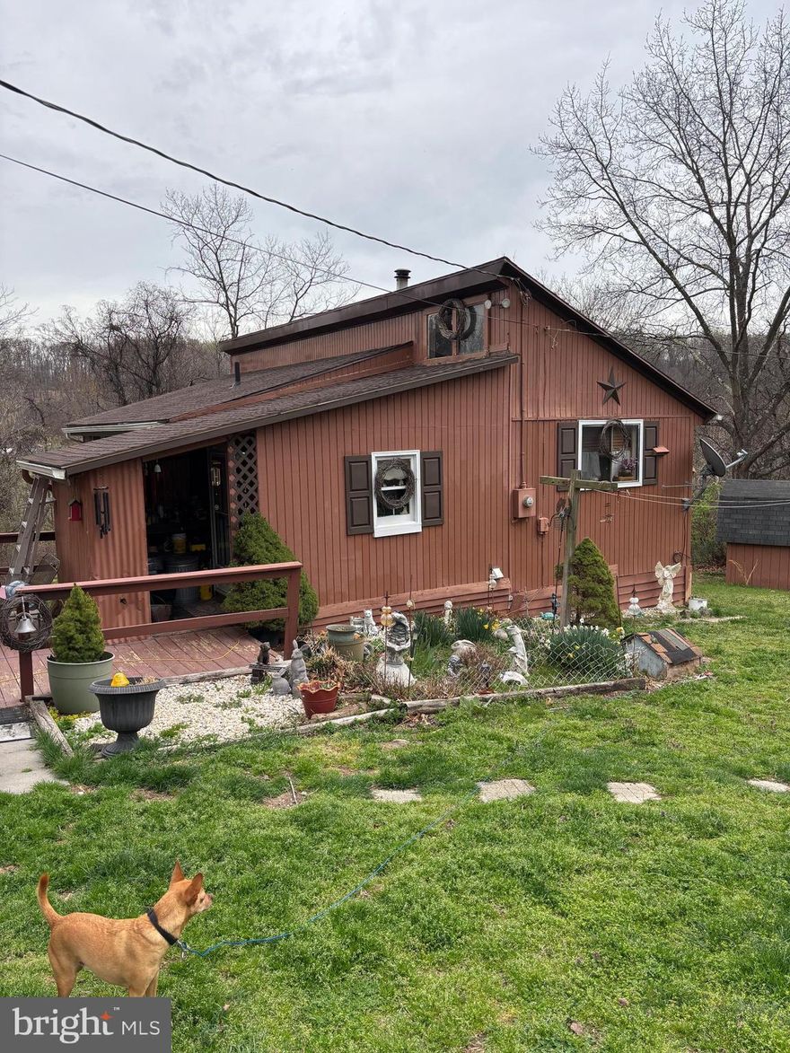 A Little House with Big Possibilities on 3.64 Acres! 
This charming 2-bedroom, 1-bath home may be modest in size, but it offers a peaceful setting, stunning views, and a rare chance to create your own country retreat. All on one level, the home features a functional layout with a kitchen, living room, and plenty of potential to make it your own. Whether you choose to update the existing structure or envision something entirely new, the setting is the true standout.
Bring your horses, chickens, and dreams—this property already includes a three-stall horse barn with electric, multiple sheds for storage or workshop space, and plenty of open land. Whether you’re looking for a quiet retreat, a hobby farm, or a place to build your dream home, this property offers endless possibilities in a scenic setting.
Only minutes from Hedgesville shopping, Martinsburg and the VA line.