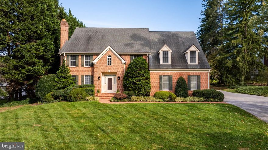 Prime Ruxton location!  Set on .7 acres, this 5 bedroom, 4/1 bath brick colonial, built in 1989 has approximately 5600 finished square feet and a gracious floor plan. Renovated custom kitchen with WodeMode cabinetry, granite counters and stainless steel appliances including Sub-Zero and Wolf. The large breakfast area flows to the adjoining and inviting family room with custom bookcases, woodburning fireplace and walls of windows with French doors opening to the brick patio and large level yard. First floor laundry room, mud room and 2 car garage. Living room has a wood burning fireplace tucked into an alcove with flanking windows, the formal dining room with built in china cabinets and French doors to the back yard. The library has custom cherry bookcases and adjoining powder room. The second level features 5 large bedrooms and 3 full baths. The primary bedroom suite has a fireplace, custom book cases and cabinetry, a large custom fitted walk-in closet and an adjoining office with additional built-in book cases and desk. The renovated primary bath has a jetted tub, shower stall and separate water closet. Lower-level music/media room (equipment negotiable), 2 climate controlled wine rooms, a full bath and a play/ exercise room. The landscaped lot provides privacy and space, while its location within walking distance to Ruxton Village shops ensures convenience. Close proximity to Towson, Greenspring Station and expressways allowing an easy commute to downtown Baltimore and Hunt Valley. 1408 Locust Avenue offers an exceptional lifestyle in a prime location!