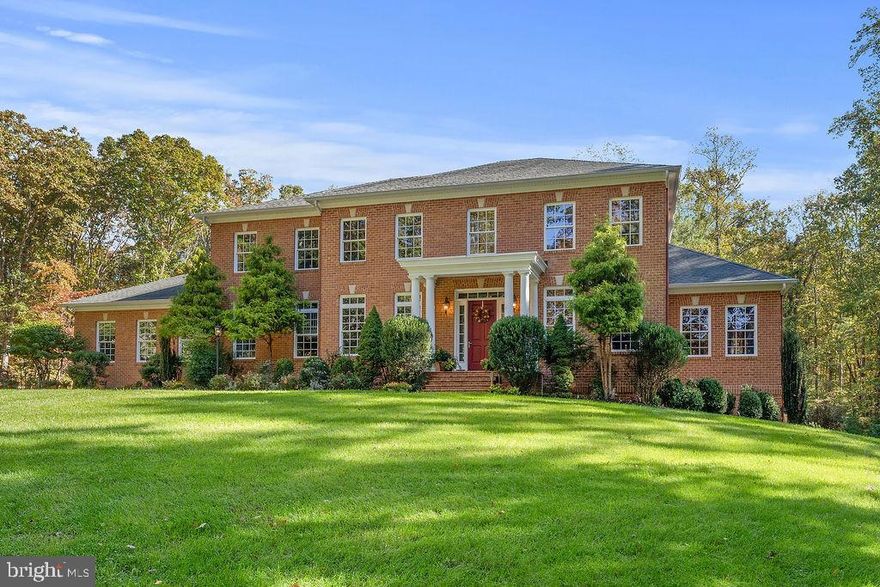 Set on five private acres surrounded by mature trees and located near both the historic Chancellorsville Battlefield and the Rappahannock River, this exceptional custom all-brick residence offers nearly 9,000 square feet of thoughtfully designed living space across three finished levels. Built in 2011, this home combines timeless craftsmanship with modern luxury, creating an ideal setting for both grand entertaining and comfortable everyday living.
The main level welcomes you with 10-foot ceilings and stunning Brazilian Cherry flooring, creating a warm and elegant backdrop throughout the living spaces. The open floor plan provides seamless flow between rooms while still offering distinct areas for gathering or quiet retreat. At the heart of the home is the well-appointed kitchen, featuring Quartz countertops, a spacious center island, two dishwashers, stainless steel appliances, a pot filler, custom cabinetry, and a tile backsplash. A breakfast bar connects the kitchen to the dining area, while the adjacent family room offers a gas fireplace and inviting space to relax.
A main-level bedroom suite with private sitting room and full bath provides excellent flexibility for guests, extended stays, or multi-generational living. The side-loading three-car garage complements the home’s architectural appeal while providing ample parking and storage.
Two staircases access the upper level. Each of the four upper level bedrooms feature their own private full bath, providing comfort and privacy. The expansive primary suite serves as a luxurious retreat with a spacious bath and two walk-in closets. A large upper-level laundry room adds convenience and functionality.
The walk-out lower level is designed for recreation, creativity, and productivity. This level includes a rec room, game room with a two-sided fireplace, media area, kitchenette, art room, bonus room, large office, and full bath—creating endless possibilities for entertainment, hobbies, or work-from-home needs.
Surrounded by natural beauty and offering exceptional space, craftsmanship, and versatility, this remarkable residence presents a rare opportunity to own a private retreat in a historically significant and highly desirable location.
Some additional features that may be unseen while touring include: wiring and plumbing for a future central vacuum system; wiring and natural gas plumbing for a future generator; natural gas plumbing for a future pool heater; a 240 volt plug in the garage; a constant pressure system for the well; spray foam insulation in the conditioned attic.