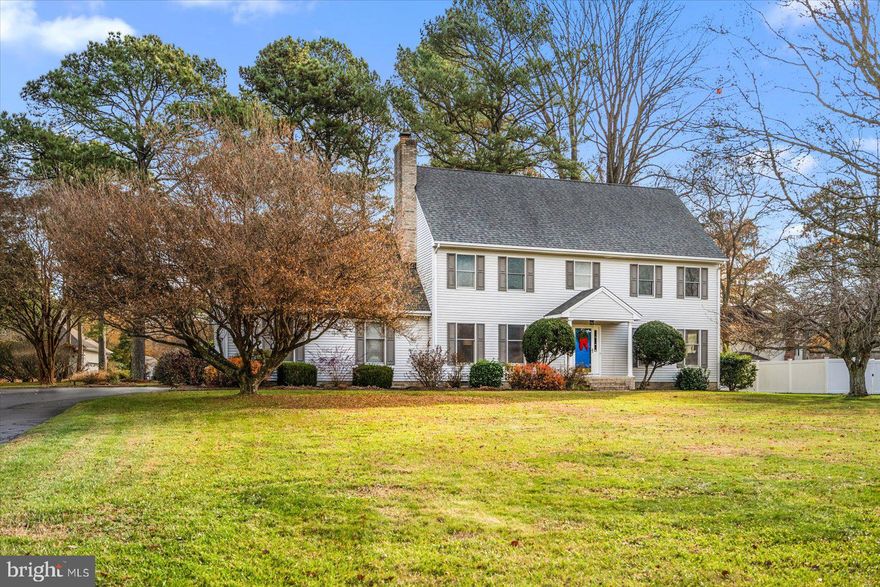 Located in the golf course community, Nutters Crossing, and sited on a .57 acre lot, this well maintained 2417 sq ft, 4 bedroom, 2.5 bath residence exemplifies pride of ownership. The 1st floor features an inviting layout that includes a welcoming foyer w/ tile flooring and powder room access, a living room and dining room w/ hardwood flooring, an updated kitchen w/ solid surface countertops, stainless appliances, pot rack, hardwoods and a casual dining area that is open to the family room w/ masonry fireplace, hardwood flooring, screened porch access and access to the laundry room and garage.  The hardwood staircase leads to a spacious primary bedroom w/ ample closets and a private bathroom w/ double bowl vanity, whirlpool tub, and separate room w/ toilet and tub/shower unit. Three additional bedrooms, a hall bathroom, and access to the walk-up attic complete the 2nd floor. The home's exterior offers a 12 x 14 screened porch, in ground irrigation, and a paved driveway leading to the 2-car garage.  The septic is approved for 6 full time residents and was inspected by Blue Wave Environmental Consulting, LLC on 12/7/23. Recommended repairs were completed by septic contractor Barry Phippin on 12/9/2023.