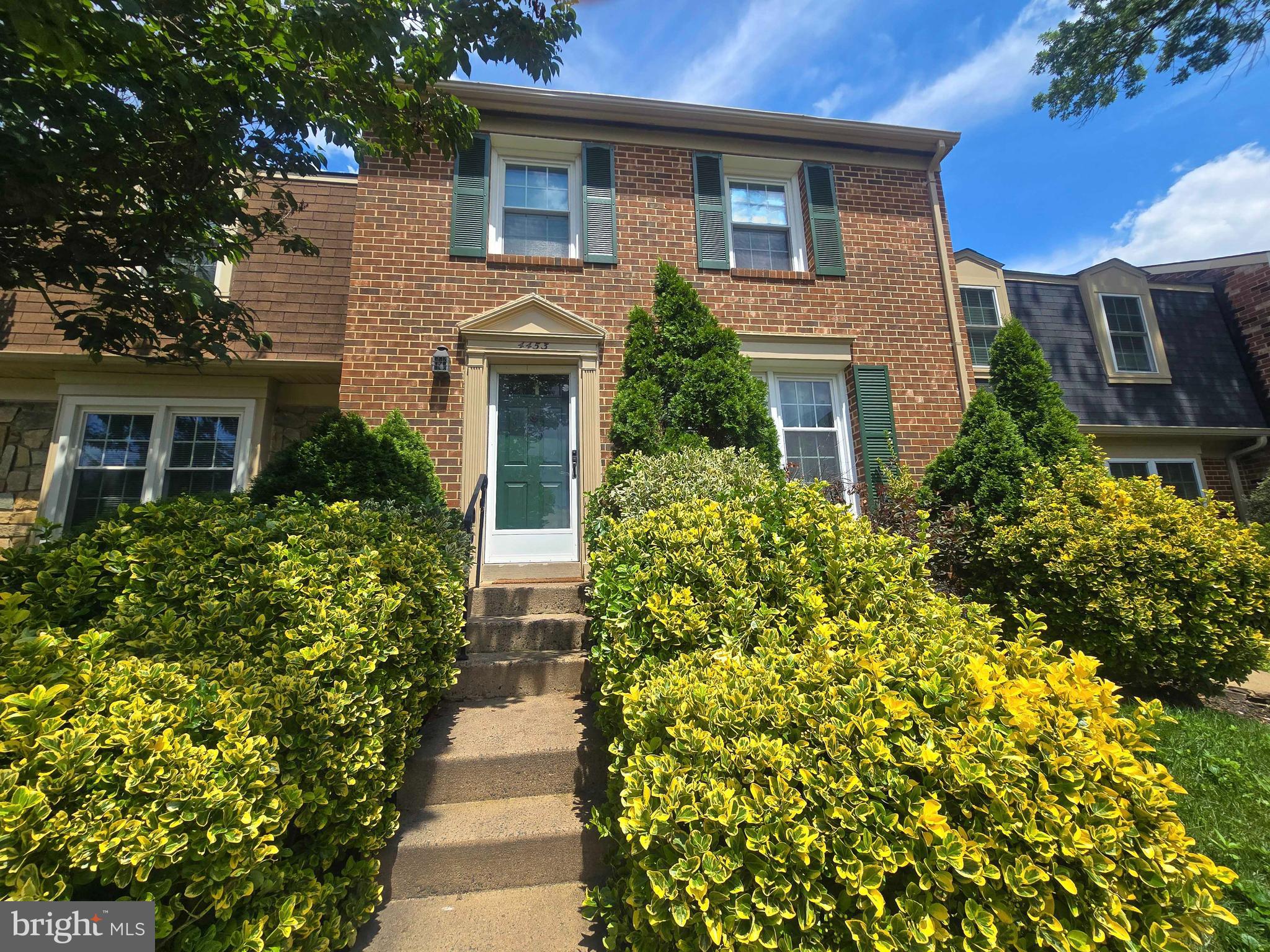 All brick, bright & shiny 3-Level Townhouse in the heart of Annandale. Come inside and see the great care the owners have taken of this place. Walk through the main level with bright living spaces, a separate dining area, and a half-bathroom. The space has been updated with hardwood floors on all levels, a wide-open, light-filled kitchen with quartz countertops, stainless steel appliances, and white cabinetry offering plenty of storage. Upstairs, you will find three bedrooms, including an owner's suite with a private vanity area, two bedrooms, and an additional bathroom. The basement level comes with a full bathroom, an office space, and a family room with a sliding door to a fenced-in patio with storage.