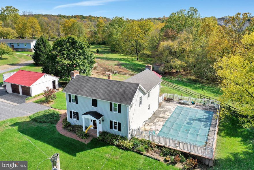 Take look at this farmhouse!  Enter through the sunroom that has a gorgeous brick floor, hook up for a woodstove and  of course lots of light! Walk into the inviting kitchen with granite countertops, clean white cabinets and dining room with a brick fireplace and exposed wood beams!  Great for entertaining friends and family!  Take the hallway past the pantry and the  1/2 bath to the very cozy sitting room with a gas fireplace to warm up those cool fall evenings  that are coming soon.  Upstairs you will find 3 lovely bedrooms and a full bath (very spacious). This home has ceiling radiant heat throughout.  Walk outside, just steps from the sunroom to an amazing in ground pool and pool house.  Summer entertaining will be a cinch!  The pool house has a stone wine cellar underneath!  Pool house could very easily be turned into additional living space as it is already hooked up with electric baseboard heat and wiring.  Bring your animals!  This 4.69 acres has a running stream,  a two stall barn and run-ins.  The chicken coop is ready for your use! The pastures are board fenced and reinforced with solar powered electric. This property has  beautiful hard woods such as Black walnut, Sycamore and Maple trees as well as flower gardens and brick side walks.  The two car garage has ample storage, work benches, cabinets and attic space with pull down stairs. There is a virtual tour online.  This home is located just inside the Berkeley line  very convenient to Shepherdstown/Martinsburg and Charlestown. Don't let this one get away!