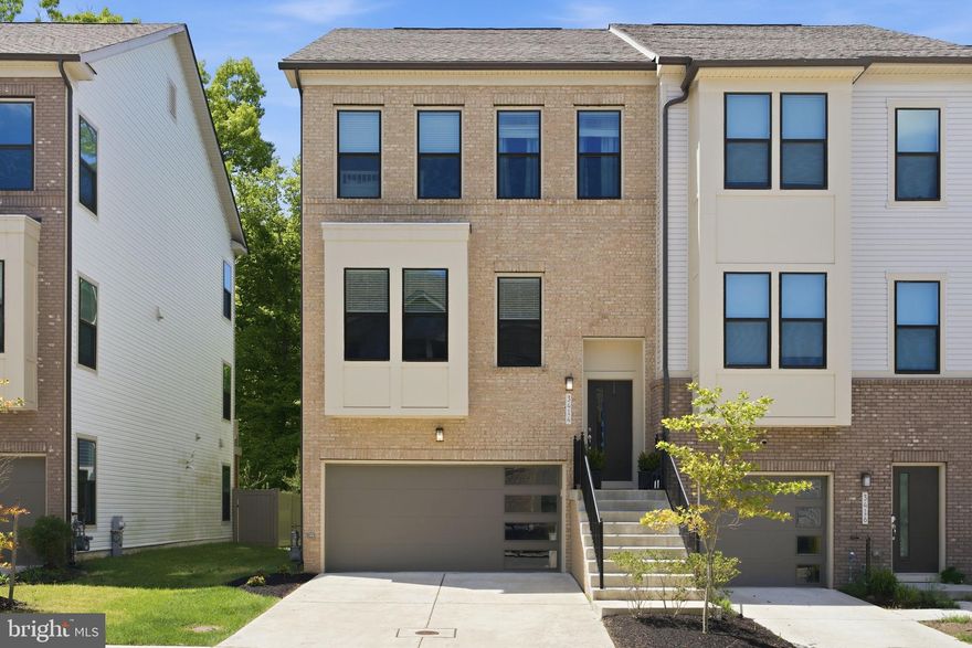 In new construction, the lot is everything—and this stunning Watershed townhome is a winner. Built in 2022 by Pulte Homes, this Greywood end-unit stands out above the rest. Perfectly positioned along the perimeter of the community and backing up to protected land, it delivers a level of privacy and tranquility that is next to impossible to find today.

The sleek, contemporary exterior serves up major curb appeal, and the wow factor continues inside. Thoughtfully designed with 3 bedrooms, 2 full baths and 2 half baths, and well over 2,500 square feet of living space, this home feels massive. With bump-outs on every single level and walls of windows pouring in natural light, you’ll completely forget it’s a townhome. The premium upgrades are already done for you—from sleek ceiling fans in every bedroom to a tricked-out surround system on the main level and deck.

The kitchen is undeniably the heart of the home, flexing standout features like under-cabinet lighting, a massive island and huge pantry. The main level layout is all about flexibility; utilize the added bump-out for dining to create two distinct living areas on either side of the kitchen, or keep its current setup as a home office or sitting room with wooded views.

Head upstairs to an expansive Owner’s Suite that acts as a true private retreat. It features two large walk-in closets and a spa-like en-suite with an oversized frameless shower, double vanity with beauty bar, and a private water closet. Second-floor laundry and a generous linen closet add effortless convenience to your daily routine.

If you love to entertain, the lower level is ready to host. It features a spacious rec room, an additional bump-out currently set up as an epic gaming zone, and a convenient second half-bath for guests. Even the two-car garage overachieves, offering dedicated, built-in space just for storage.

Top it all off with Watershed’s highly coveted resort-style amenities and unbeatable proximity to shopping, dining, major commuter routes, and Fort Meade -- this is the definition of a turn-key upgrade you don’t want to miss.