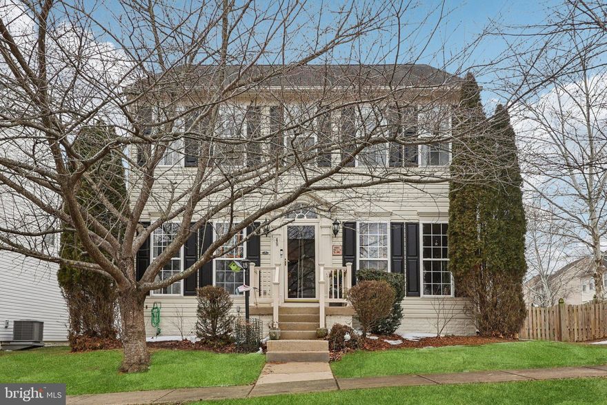 Beautifully maintained Neo-Classical end-unit single-family home in the highly desirable New Town Meadows community, just a short walk from the heart of Lovettsville. Situated on a coveted corner lot, this property offers added yard space and privacy—making it a rare opportunity in the neighborhood.
This thoughtfully designed home features five bedrooms and three and a half baths with flexible living spaces ideal for modern lifestyles. Meticulously maintained and artistically decorated, the home welcomes you with abundant natural light, gleaming hardwood floors, and an open floor plan where the kitchen and family room flow seamlessly together—perfect for everyday living and entertaining. The family room centers around a cozy gas fireplace, while the modern kitchen features granite countertops, a large island with bar seating, and a bright breakfast nook. A conveniently tucked-away laundry and storage area completes the main level.
Upstairs, the spacious primary suite offers a walk-in closet and an ensuite bath with soaking tub, frameless shower, double vanities, and private water closet. Three additional generously sized bedrooms share a well-appointed hall bath.
The finished lower level provides exceptional versatility with a large recreation room, dedicated flex space ideal for hobbies or play, and a true fifth bedroom with egress window—perfect for guests, multigenerational living, or a private office suite—along with a third full bath.
Outdoor living is equally inviting with a private backyard, beautifully crafted picket fence, and stone patio ideal for relaxing or entertaining. A two-car garage provides ample parking and storage.
Living in Lovettsville means embracing a vibrant small-town lifestyle. Enjoy beloved community events such as Lovettsville’s Oktoberfest, farmers markets, parades, and year-round gatherings. The home is within easy walking distance to Lovettsville Town Square, local shops, restaurants, parks, and nearby wineries and breweries. For commuters, the MARC Train in nearby Brunswick provides convenient access to Washington, D.C., offering the perfect blend of small-town charm and metropolitan accessibility.