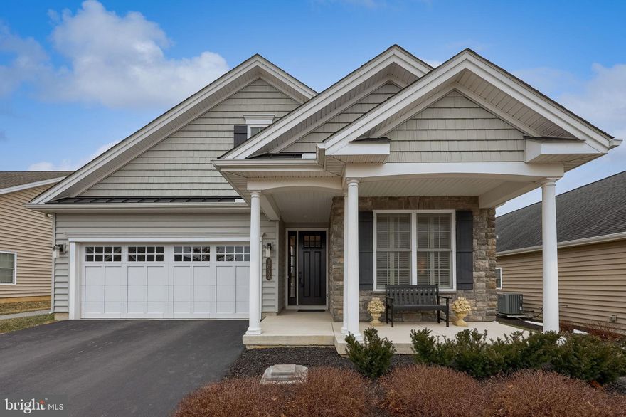Welcome to 1032 Presidents Drive in the popular community of Traditions of America at Lititz. This home is truly lovely, offering a muted and soothing color palette in white and gray tones. The rich looking plank flooring throughout is easy to care for. The home has been professionally updated with class and comfort in mind. The improvements to the kitchen include Corian countertops, farm sink, soft closing pull out drawers, under cabinet lighting, custom designed center island with plenty of storage drawers and a matching Corian countertop, carefully selected tiled back splash and a never been used dishwasher. The thoughtful great room additions feature a gas fireplace with mantle. The primary bathroom update features useful extended counter space and attractive walk in shower. Found off the great room, the Sun room greatly extends the home’s living space and is the perfect place to peacefully begin your day, enjoy some afternoon quiet time, or retreat in the evening for relaxation. It provides a wonderful entertaining space for family and friends as an extension of this home’s wonderful open floor plan.  Enjoy the exterior patio found just off the Sun room.  One of the many walking trails is found beside the home and behind it as well.  Plan your visit today! Why choose Traditions in Lititz when there are other 55+ communities? Just ask anyone who lives here! Residents LOVE Traditions of America at Lititz and the high quality of life offered within and surrounding this special community. The amenities are first class and there are a plethora of activities from very enthusiastic Bocce Ball and Pickle Ball groups to Travel, Fine Dining and Life Long Learning clubs. There are walking paths within and adjacent to the community for nature lovers AND the fact that it is also within walking distance to Lititz, with its friendly sense of community, unique shops, restaurants and an energetic event calendar. It is also close to UPMC Hospital, dentist & doctors, offices for professional services, drugstores, banks, grocery stores, Target, Starbucks, and dining choices.