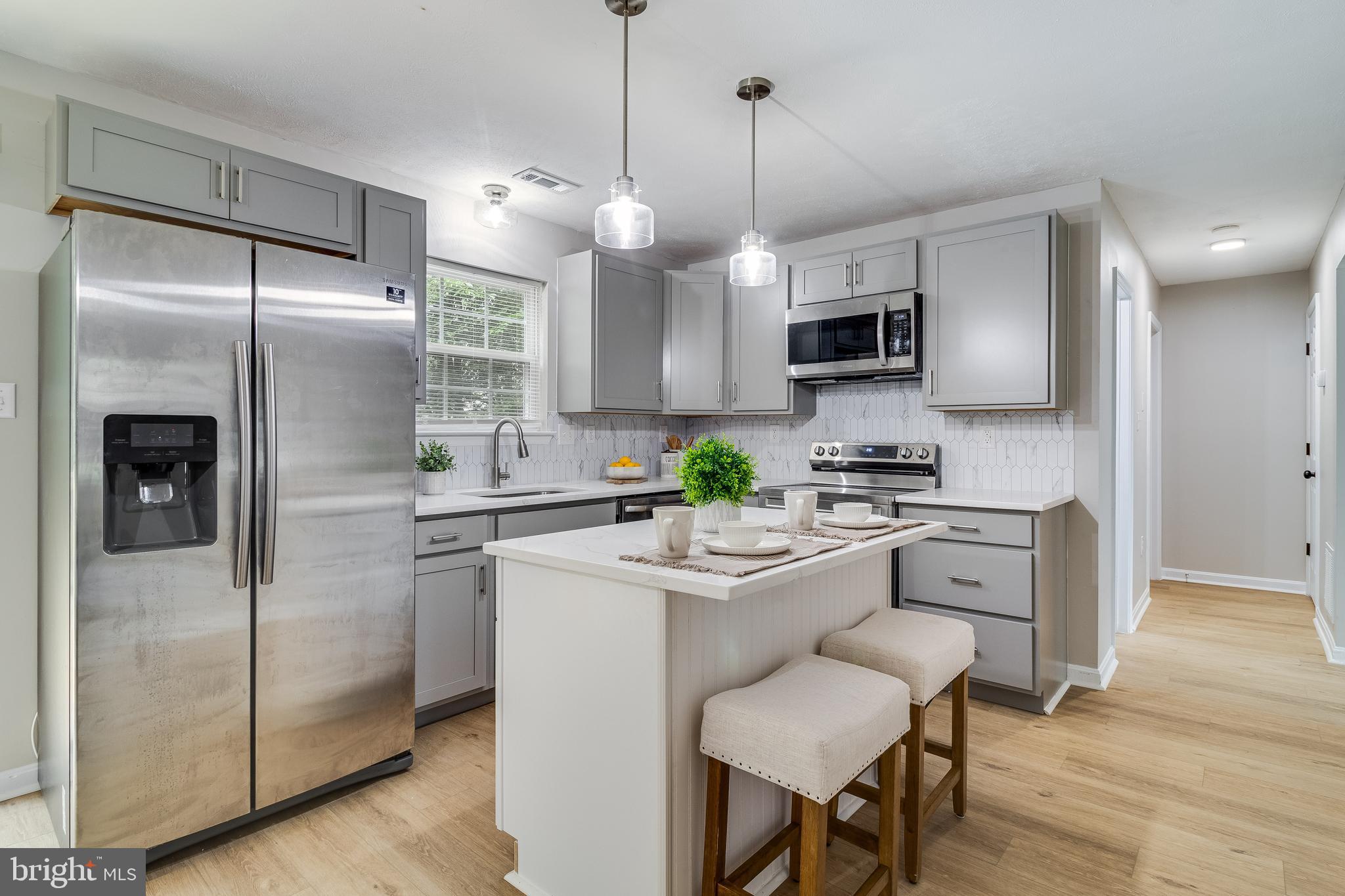 This gorgeous colonial in Laurel Glen is completely remodeled & ready for it's new owner! Featuring 4 bedrooms and 2.5 bathrooms, a spacious living room & open kitchen/dining area with beautiful plank flooring throughout. Enjoy your brand new kitchen with soft -close shaker cabinets, quartz countertops & SS appliances. Upstairs features 4 bedrooms including a large owner's suite with a walk-in closet & beautiful marble tile throughout the bathrooms. Cute front porch & a back deck for the outdoor lovers! This home also has a new HVAC system, Roof & Crawl space offering peace of mind for the future. This is such a great location tucked away in a nice quiet neighborhood but close to the base, shopping & restaurants!