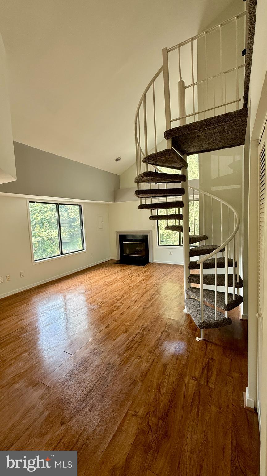 Wonderful open floor plan! Fireplace! Upper loft. Soaring ceilings! Great location! Private balcony and separate porch area. End unit. Lots of closets! Move-in ready. Make this your new home today!