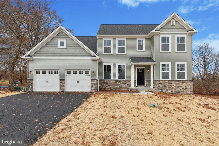 **Now ready for immediate delivery!** Just completed with additional upgrades: luxury vinyl plank and luxury vinyl tile flooring, upgraded carpet pad, gas fireplace,  soaking tub, double vanities, stylish two-tone kitchen cabinets, granite countertops, garage door openers, and additional recessed lighting.  
Welcome to 2803 N Charlotte Street: a stunning new construction home nestled on just under an acre. Thoughtfully designed for comfort and modern living, this home features an open-concept floor plan with generous living spaces, 4 bedrooms, and 2.5 baths.  
The first floor boasts a bright and airy foyer with and open and inviting dining room to one side and a cozy office/study to the other.  The great room opens effortlessly into the dining area and kitchen creating the perfect flow for everyday living and entertaining. The kitchen includes a large center island, stainless steel appliances, and ample cabinetry, ready for your personal touch. The walk-in pantry and powder room are tucked out of sight near the garage entryway. Up the lovely switch-back stairs, you’ll find four spacious bedrooms, a hall bath, and the convenient laundry room. The large primary suite features 2 walk-in closets and en-suite bath with shower, free-standing tub, and double vanity.  
Enjoy the peaceful surroundings of the oversized lot ideal for outdoor gatherings, gardening, or simply relaxing in your own private backyard.  Located in the highly desirable Boyertown Area School District, and just minutes from shopping, dining, and commuter routes, this is a rare opportunity to own new construction with no HOA and ample space to spread out.