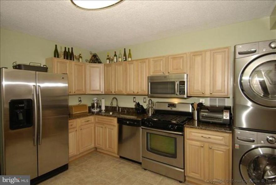 Only 0.7 miles to the Mark Center * Pristine unit  * updated Kit * updated baths * Rent includes condo fee which covers all utilities and great amenities * entrance on same level as lobby * unit on back side of building facing trees is actually 3 levels up * Parking on 1st level makes for easy in / out of garage * Large balcony * Bus stop at front door * 24 hr security * close to shops/restaurants