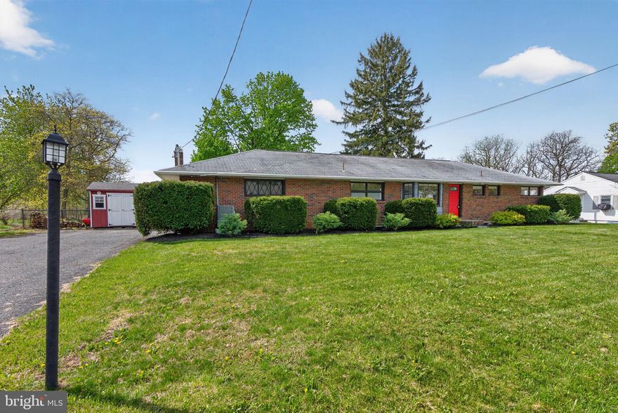Located in Bushkill Township within the Nazareth School District, this brick ranch sits on just over a third of an acre with open views of the surrounding hills and countryside. The home offers comfortable one-floor living with a functional layout and plenty of natural light throughout. The main living room features large windows and hardwood flooring, creating a bright and welcoming space. The updated kitchen and dining area are positioned nearby, offering a practical layout for everyday living and gatherings. A separate family room with a brick wood-burning fireplace provides an additional space to relax. Three bedrooms and one and a half bathrooms are located on the main level. The home also includes first floor laundry for added convenience. The basement offers significant storage and future potential. Interior access from the heated built-in garage provides an easy connection to the lower level. Outside, a covered patio creates a comfortable space to enjoy the backyard, and the fenced yard offers additional room for outdoor activities, pets, or gardening. A custom brick barbecue area and utility shed add to the functionality of the property. Conveniently located near parks, shopping, restaurants, and commuter routes, this home offers a solid ranch layout in a desirable Bushkill Township location.