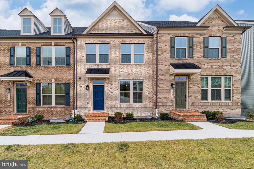 Welcome to this exquisite 4-bedroom, 3.5-bathroom townhouse featuring a covered deck off the main level, perfect for relaxing and entertaining. The gourmet kitchen boasts an expansive island and a butler's pantry, ideal for meal prep and gatherings. The master suite offers a walk-in closet and a private bath with dual vanities and a separate water closet, providing a luxurious retreat. The lower level includes a bedroom with a full bath, perfect for guests or family visits. Filled with natural light, this home creates a warm and inviting atmosphere. Don't miss the opportunity to make this stunning townhouse yours!