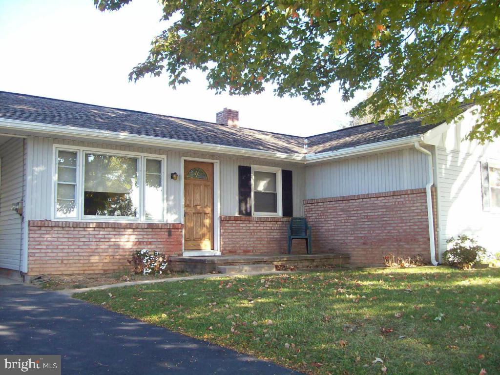 Recently painted interior, updated kitchen. Great room, dining room area off kitchen. Replacement windows, 40 year shingles on roof. Hardwood under carpet. newer furnace and central air. Great back yard space.