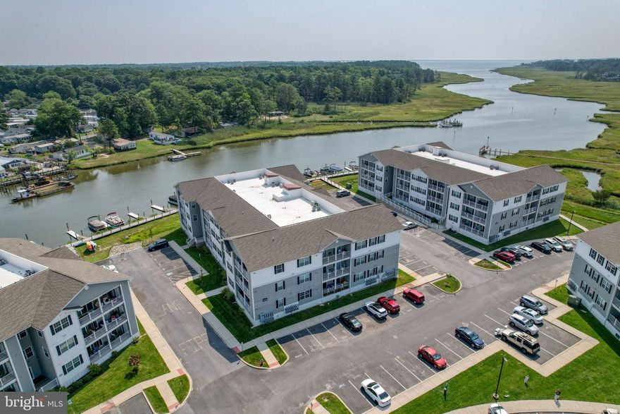 Water views await as you experience coastal living at its best in this newly renovated 2-bedroom, 2-bath condo located in a gated waterfront community. This top-floor residence offers sweeping water views from every room and the convenience of a secure elevator building. Step inside to an inviting, bright open floor plan with luxury vinyl plank flooring and abundant natural light throughout.

The gourmet kitchen showcases gleaming white quartz countertops, a subway tile backsplash, under-cabinet lighting, state-of-the-art stainless steel appliances, and ample storage space. Both spacious bedrooms feature private en-suite baths, offering comfort and privacy for owners and guests alike. The condo has been freshly painted and thoughtfully updated, with most appliances upgraded for modern efficiency and style. 
A private balcony provides the perfect setting for morning coffee or evening relaxation while overlooking Love Creek. The Residences of Rehoboth Bay offers wonderful amenities, including a pool, bathhouse,  boat ramp, boardwalk, and easy access to nearby beaches, shopping, and dining. Outdoor enthusiasts will appreciate kayaking, fishing, or crabbing right from the community dock, as well as the option to secure a boat slip at the community marina. With a proven five-year rental history, this property presents an excellent opportunity as a primary residence, second home, or investment.

Additional conveniences include assigned parking, overflow visitor parking, and a bus stop conveniently located at the entrance. The condo is wheelchair accessible, featuring handicap-friendly doors, exterior ramps, and an elevator for easy access. Whether you’re seeking a full-time residence, a beach retreat, or a smart investment property (7-day minimum rentals allowed), this home delivers the perfect blend of comfort, convenience, and serene coastal charm. Furnishings are negotiable (new/designer decorated).

Nearby attractions include:
 Rehoboth Beach Boardwalk ( 6 Miles),  Downtown Lewes (7 Miles), Cape Henlopen State Park (8 Miles),  Shopping Outlets (4 Miles), Dewey Beach( 7 Miles), Bethany Beach (18 Miles)